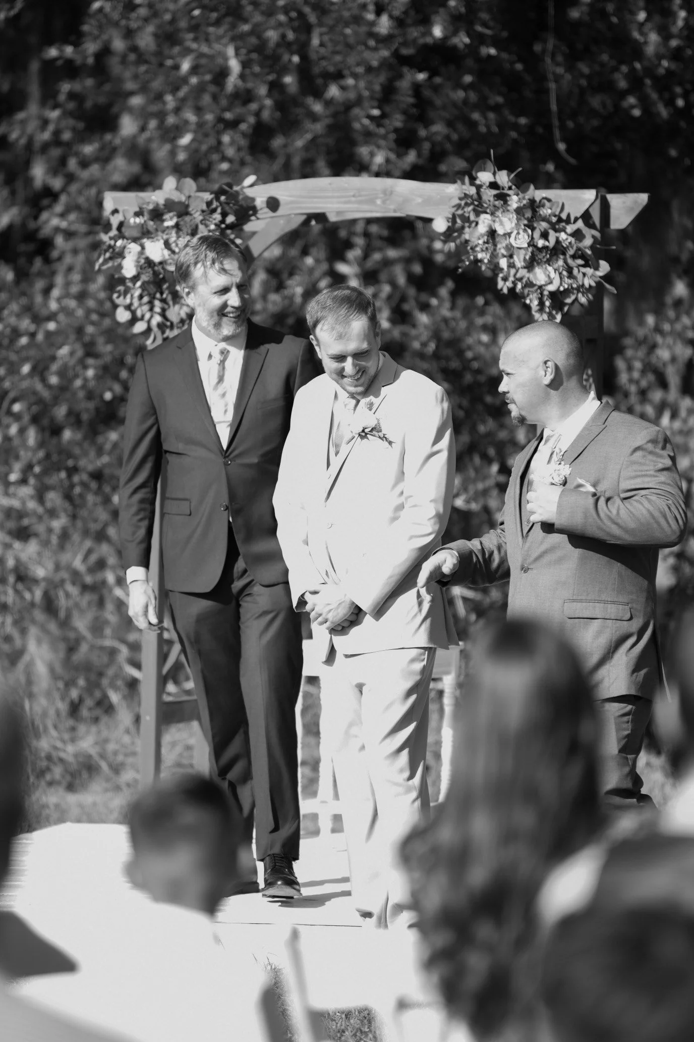 Outdoor wedding ceremony under large oak tree at Southern Georgia wedding venue.