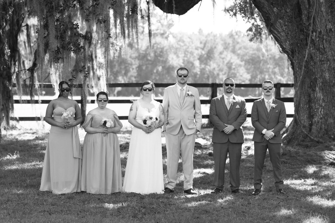 Bridal party photos under the oak trees.