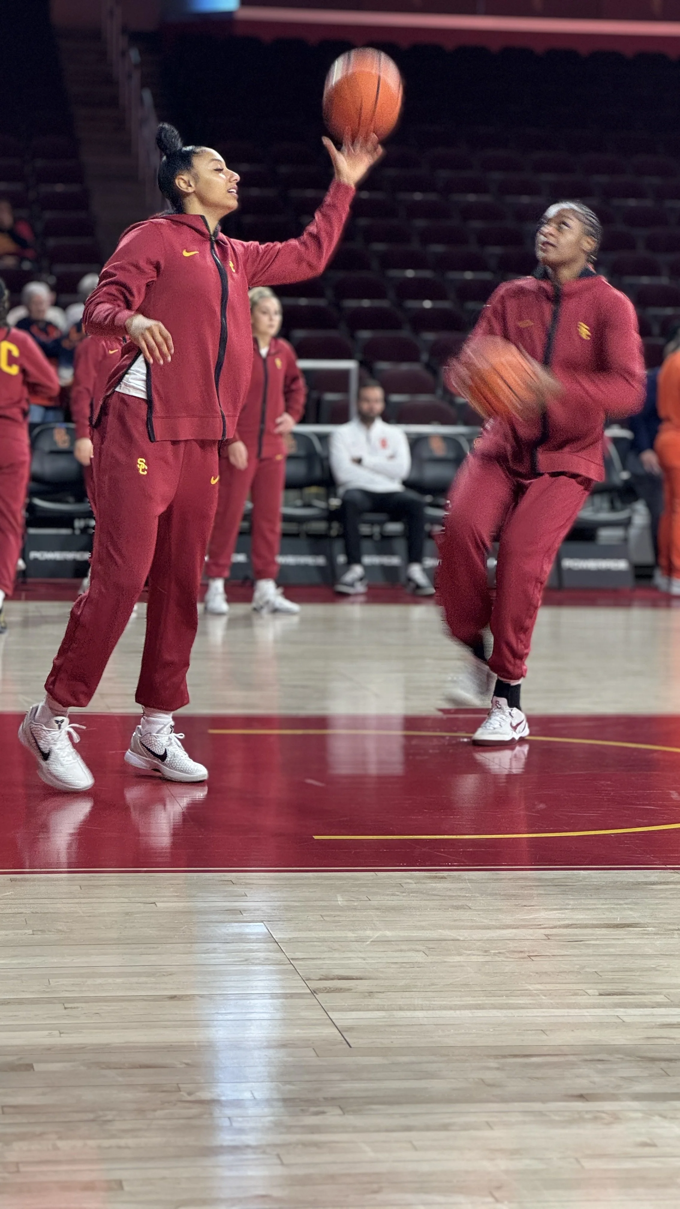Juju reaching for ball during warm ups