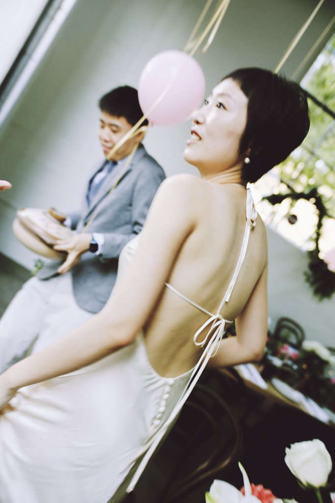 Bride and groom getting ready before an intimate wedding reception.