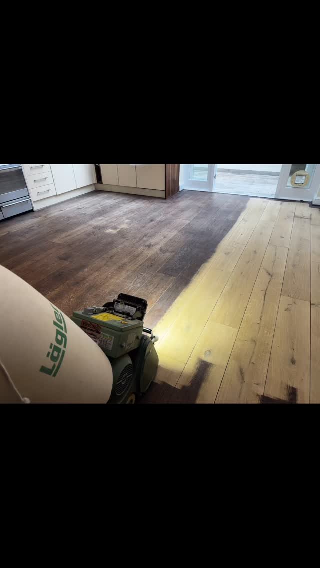 Re-surfacing engineering oak floors.