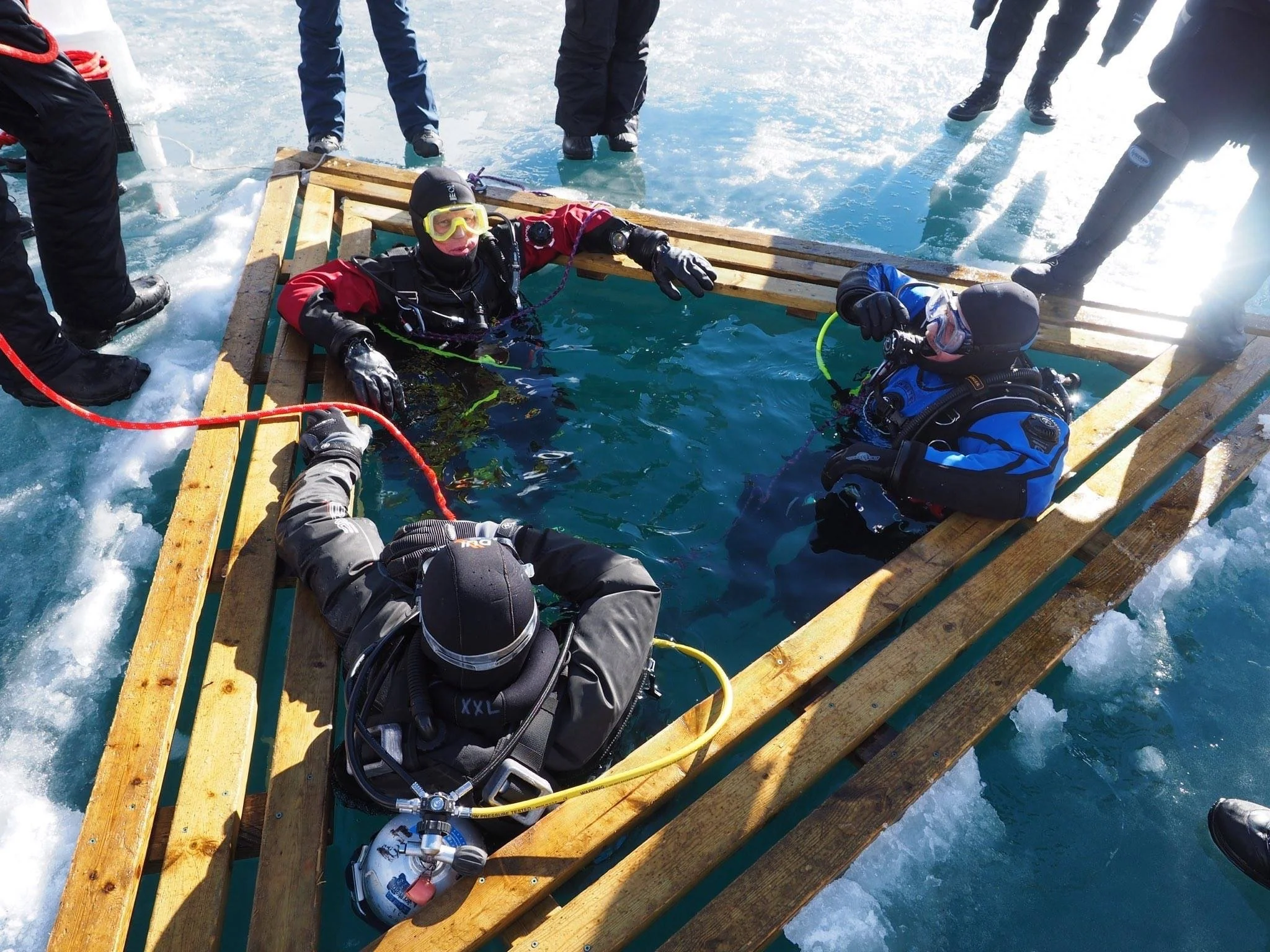 divers in the triangular ice hole, no tent needed today