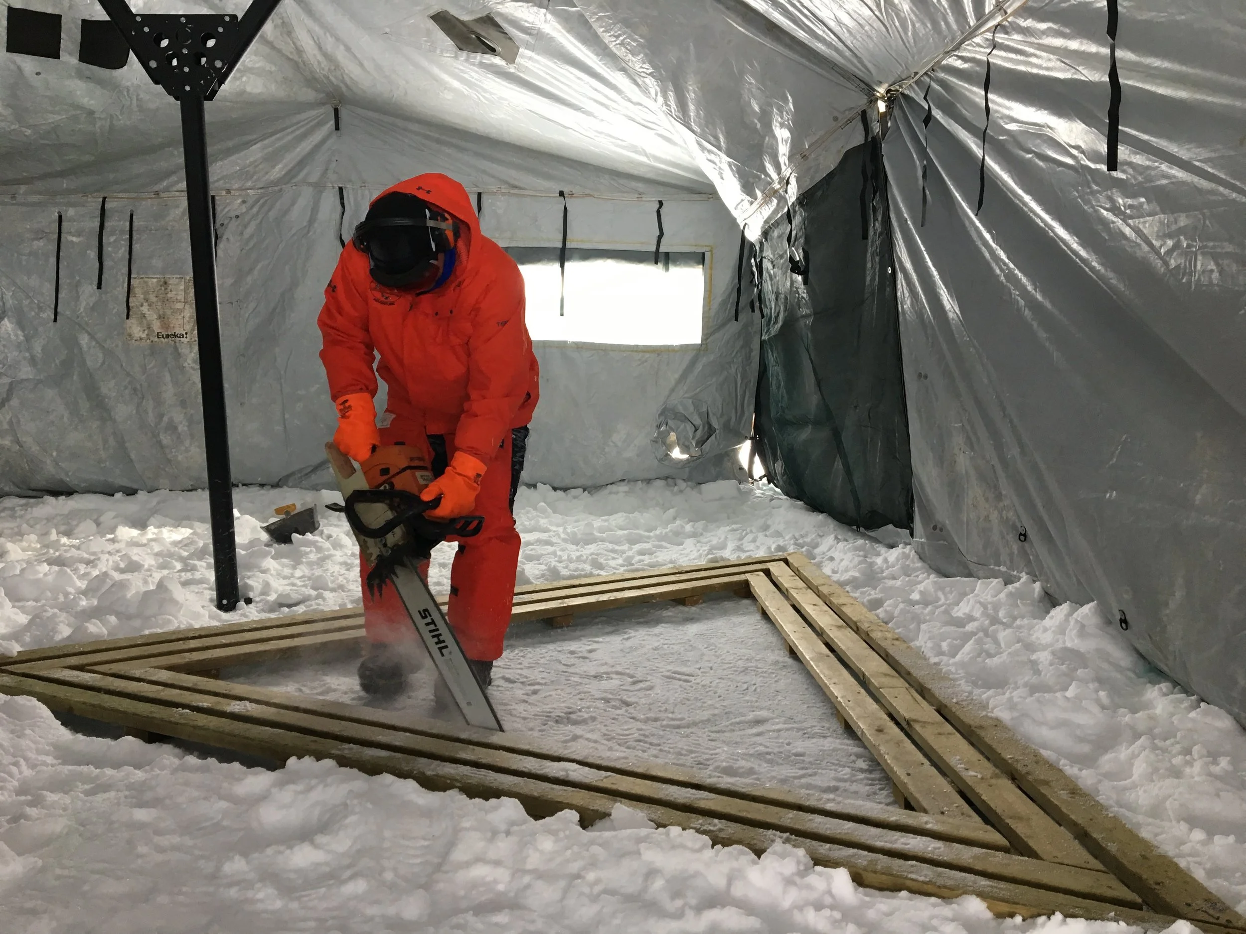 cutting the ice hole - triangle