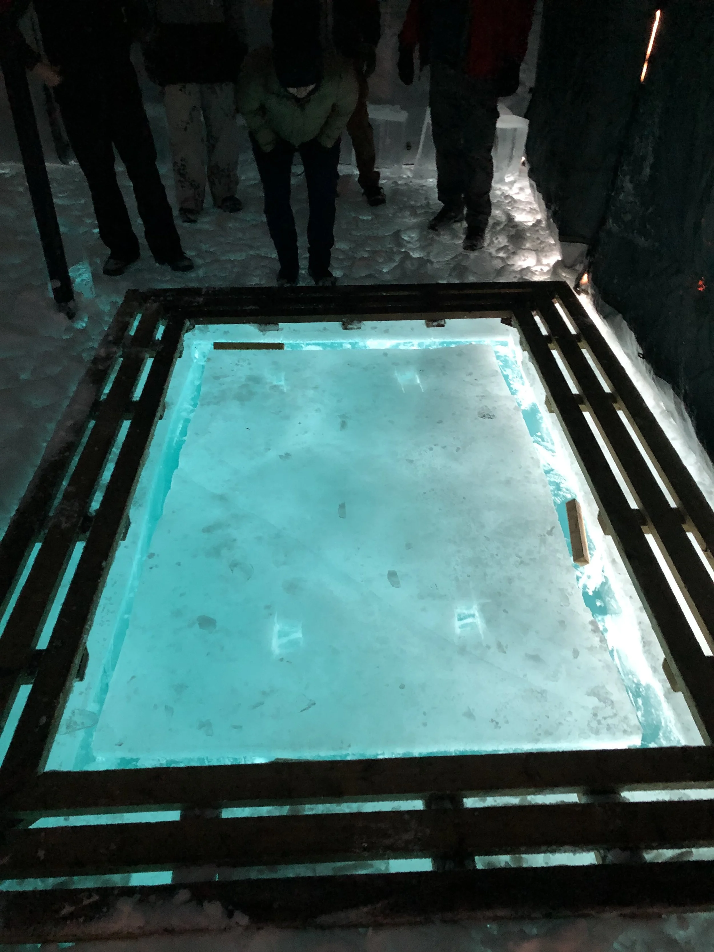 the glow of the ice hole from inside the tent