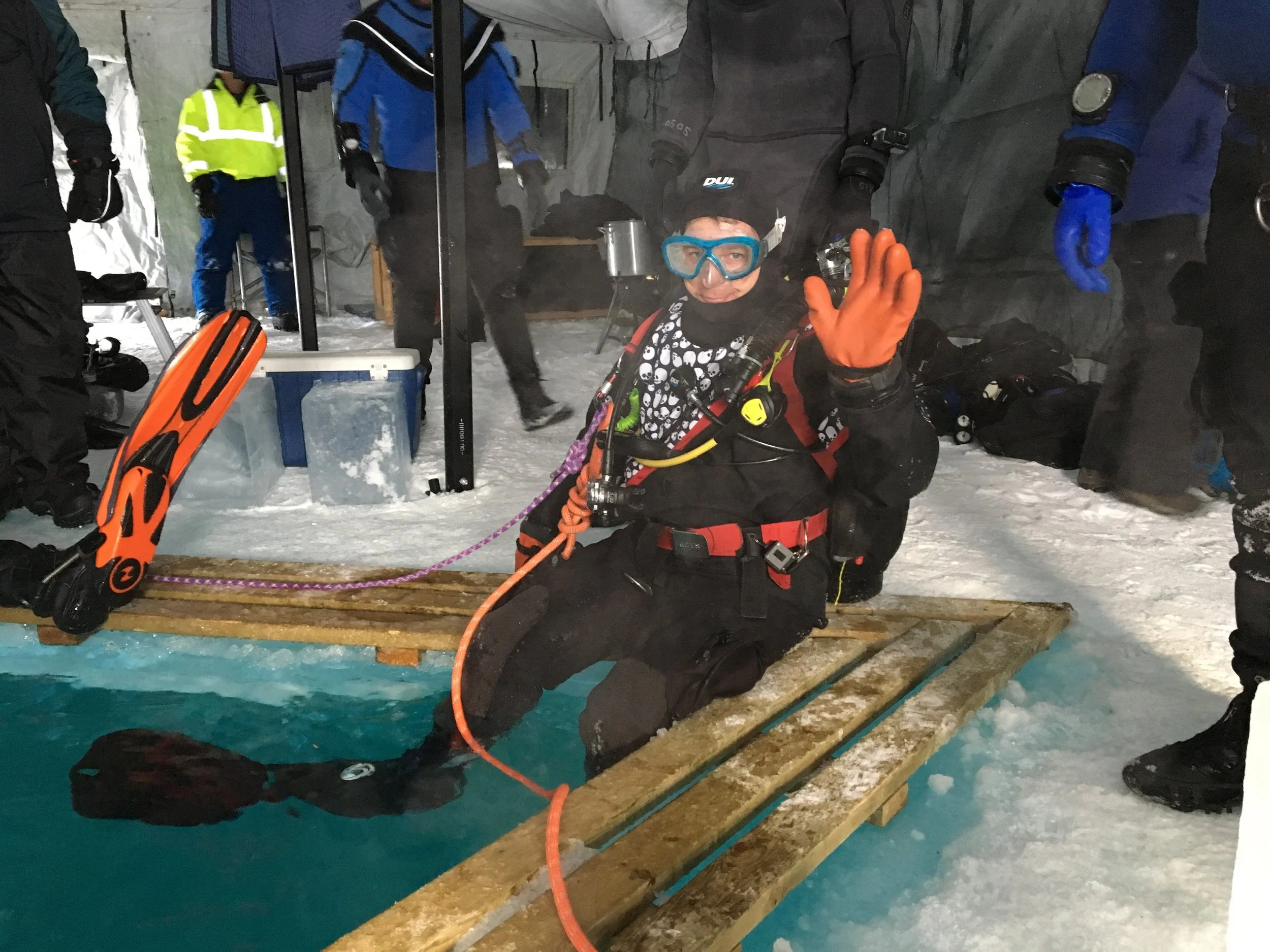 happy diver, ready to venture under the ice