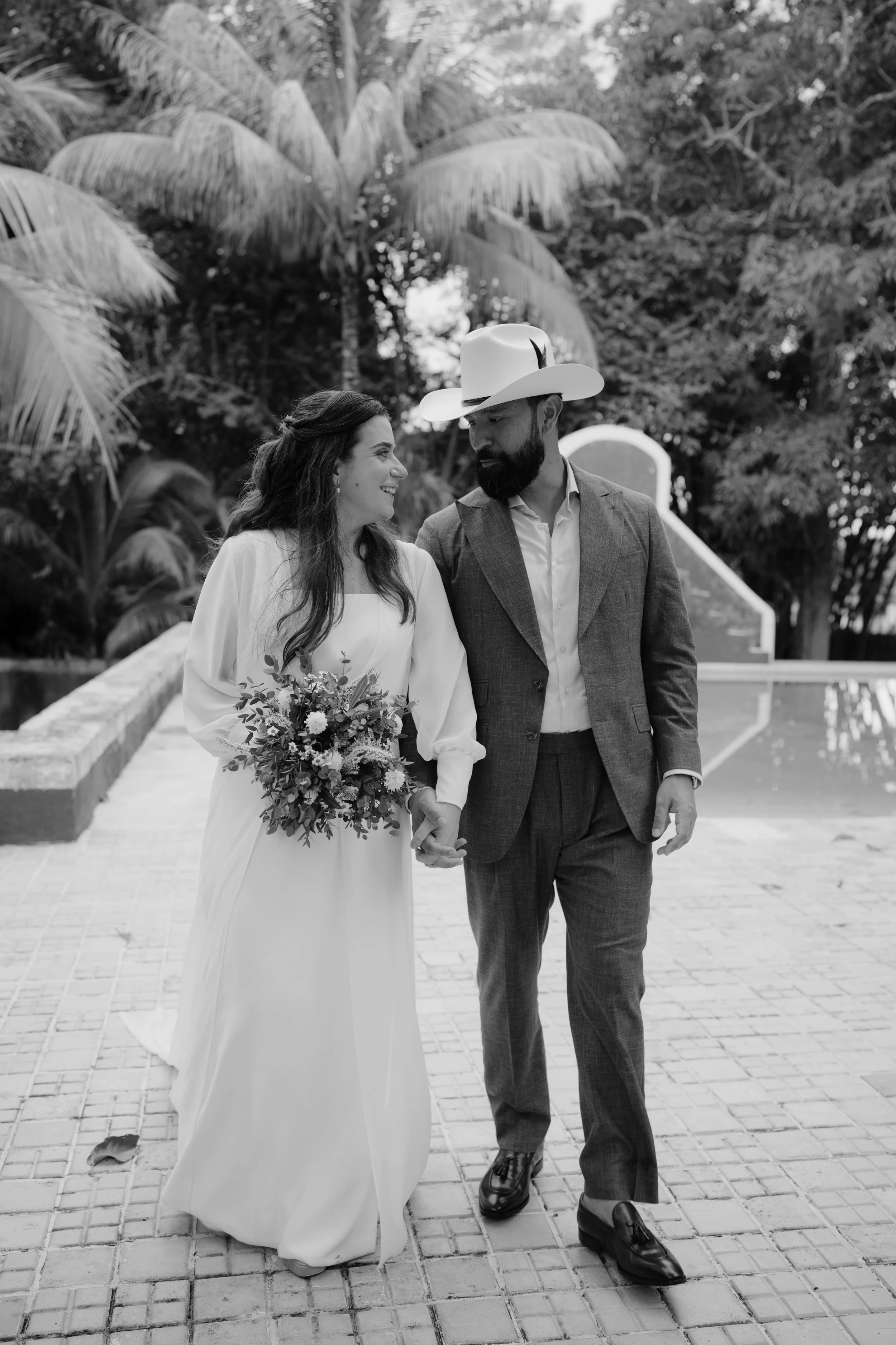 Laurie’s customers, Fernando and Kate embracing by the lake on their wedding day.