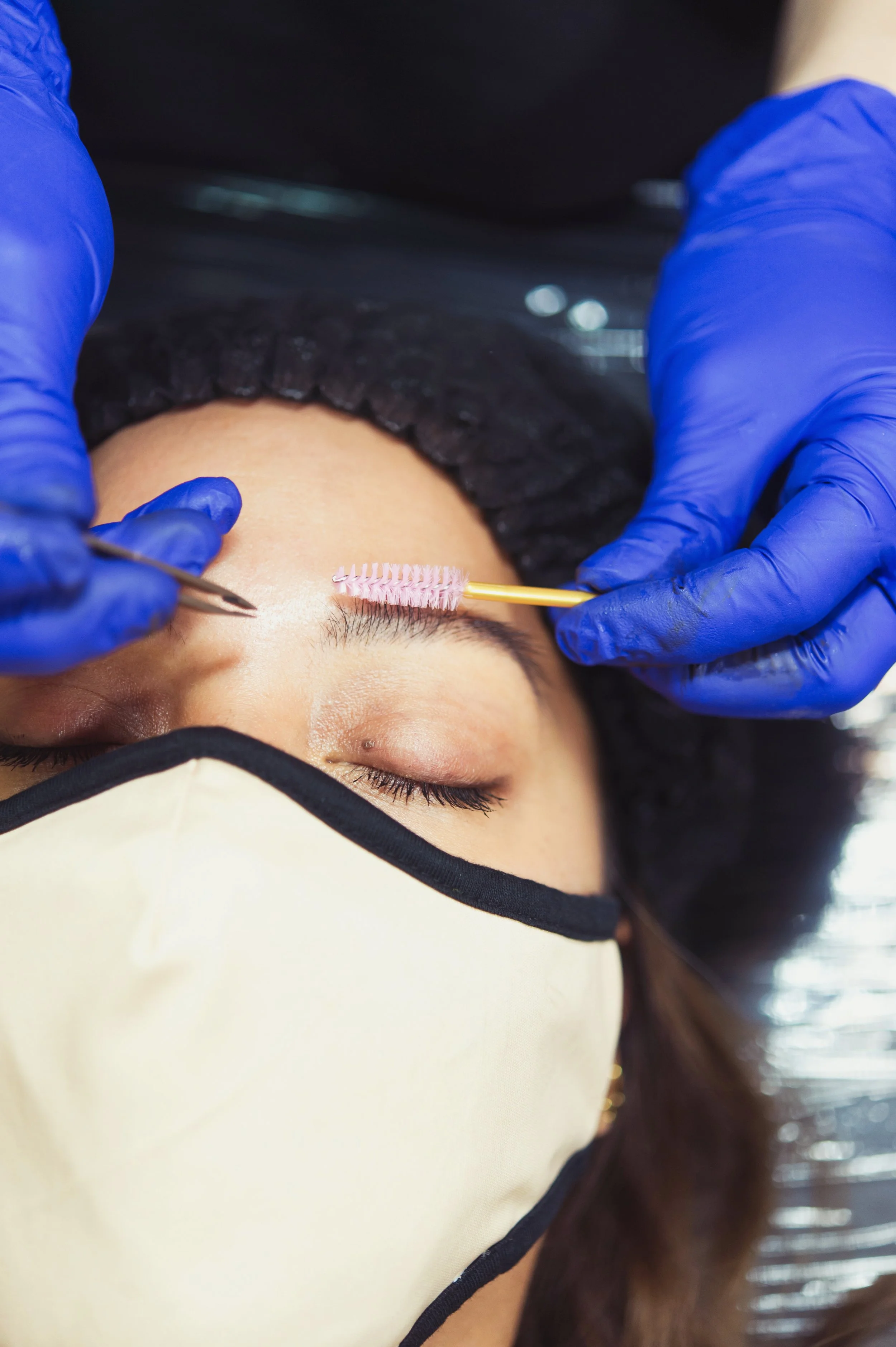 woman receiving brow shaping and design at north austin brow and lash studio