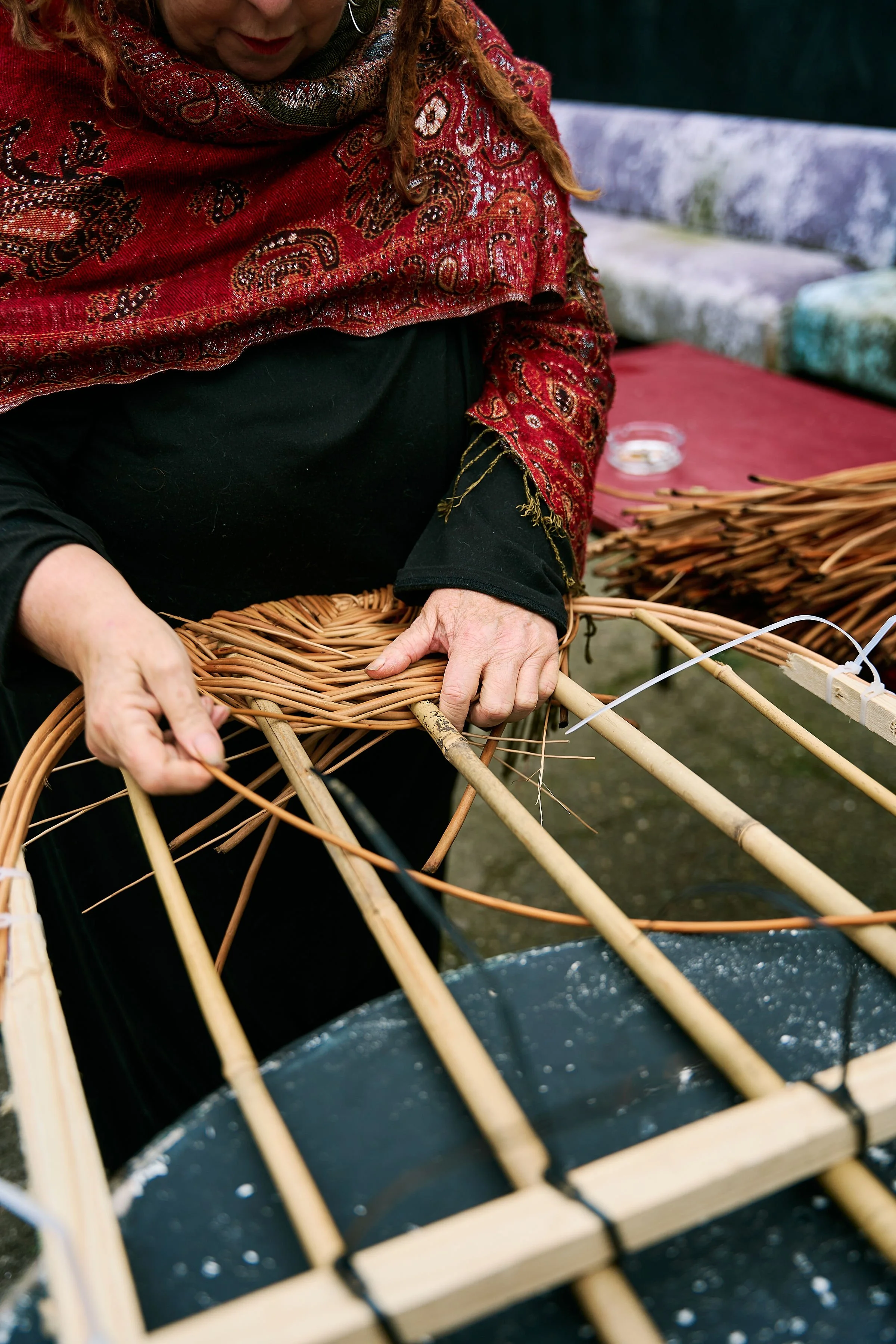 Willow, wicker casket being woven by Kate of West Country Willows at the Death Cafe during An Feile Eile. Photo taken by Dave Ryan in Killorglin, Co Kerry. Halloween Festival, Ireland