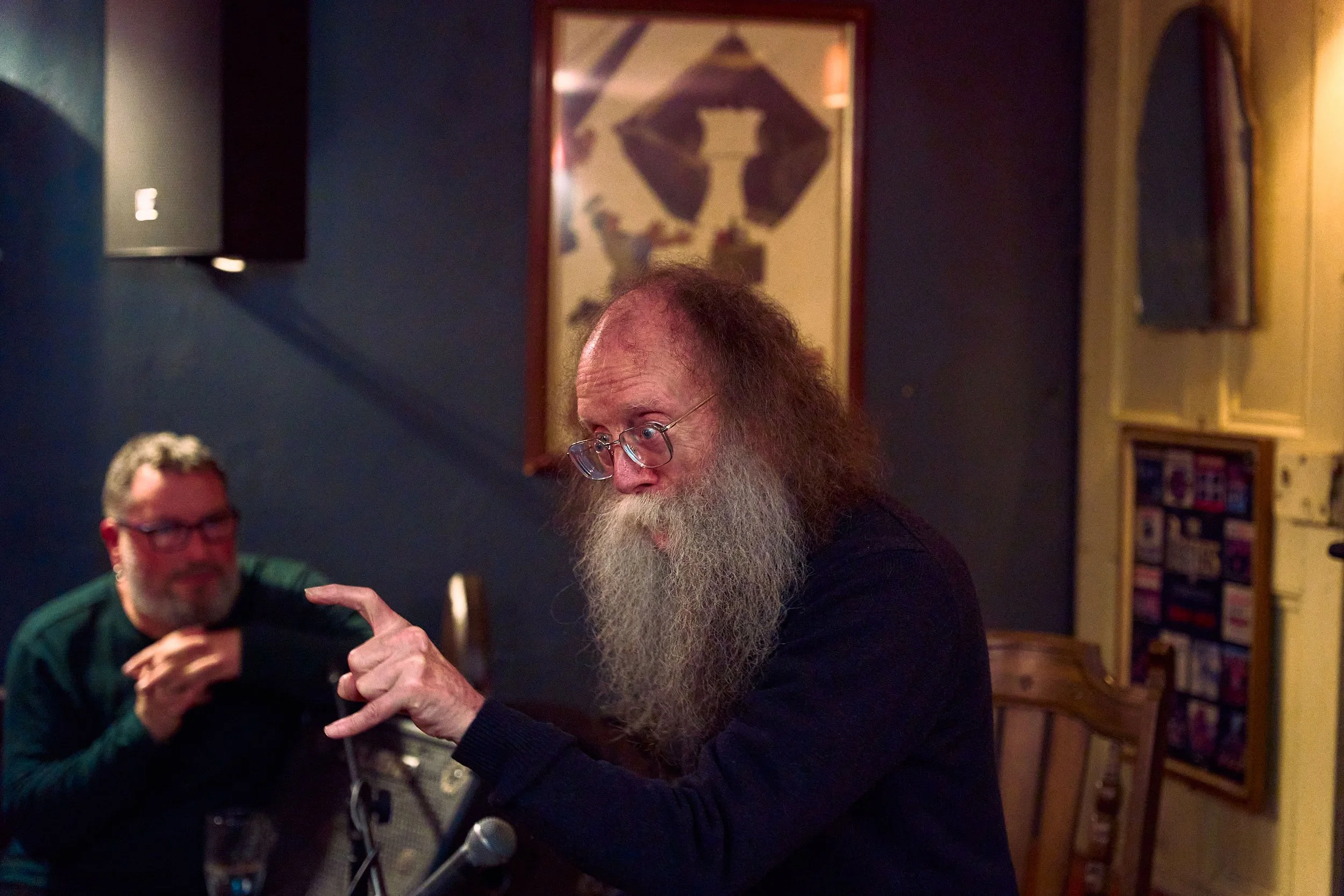 Eddie Lenihan in the grips of dark humor at Sheila Buns in Killorglin, County Kerry. Seán an Seanchaí, is smiling, watching the master tell his tales. An Feile Eile, Halloween Festival.