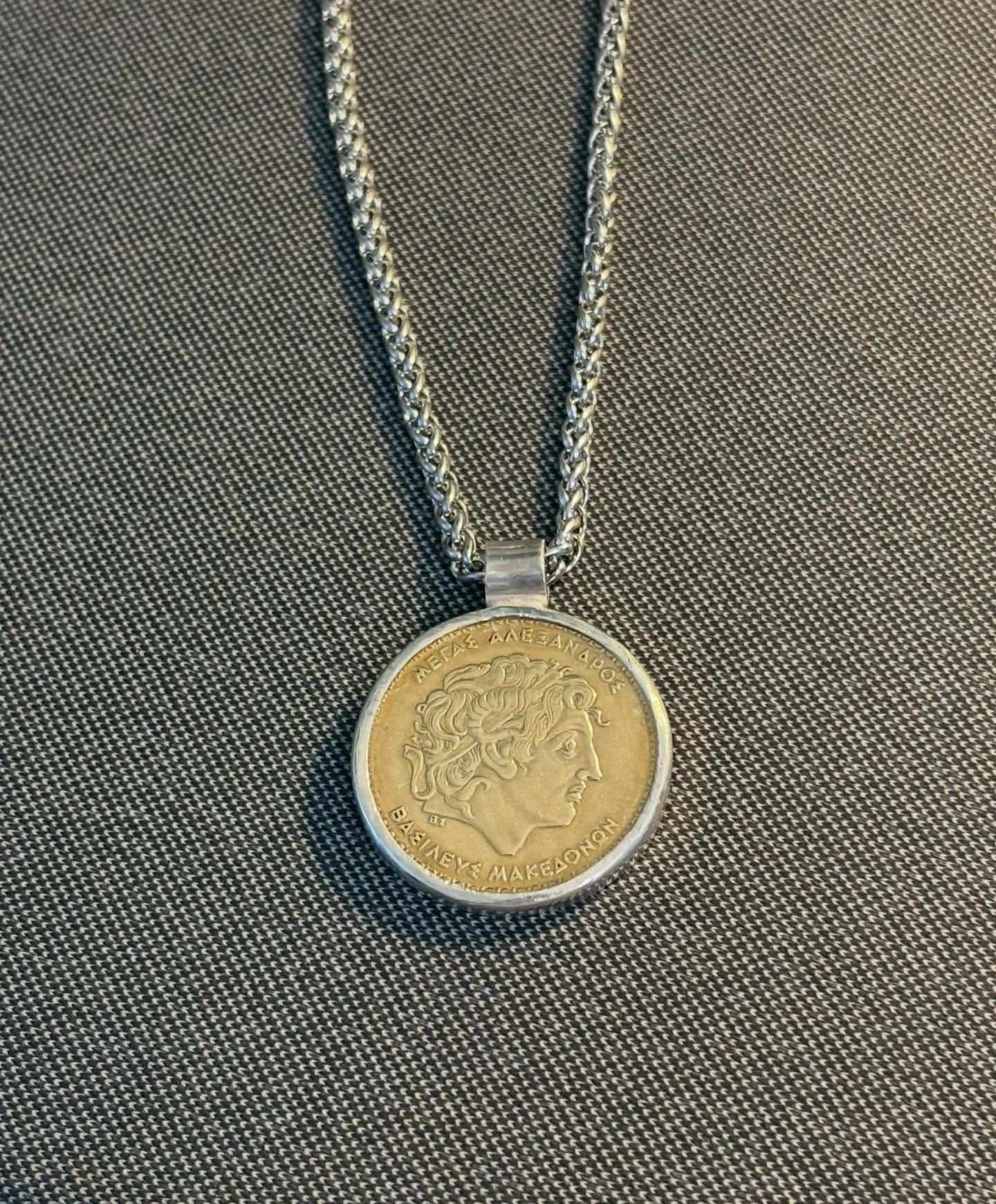 I had some old coins that i thought i would make into Pendants.  This coin is of a Greek 100 Drachmas coin depicting Alexander the Great.  I made a bezel out of Sterling Silver and gave it a rustic old finish.  What do you think?