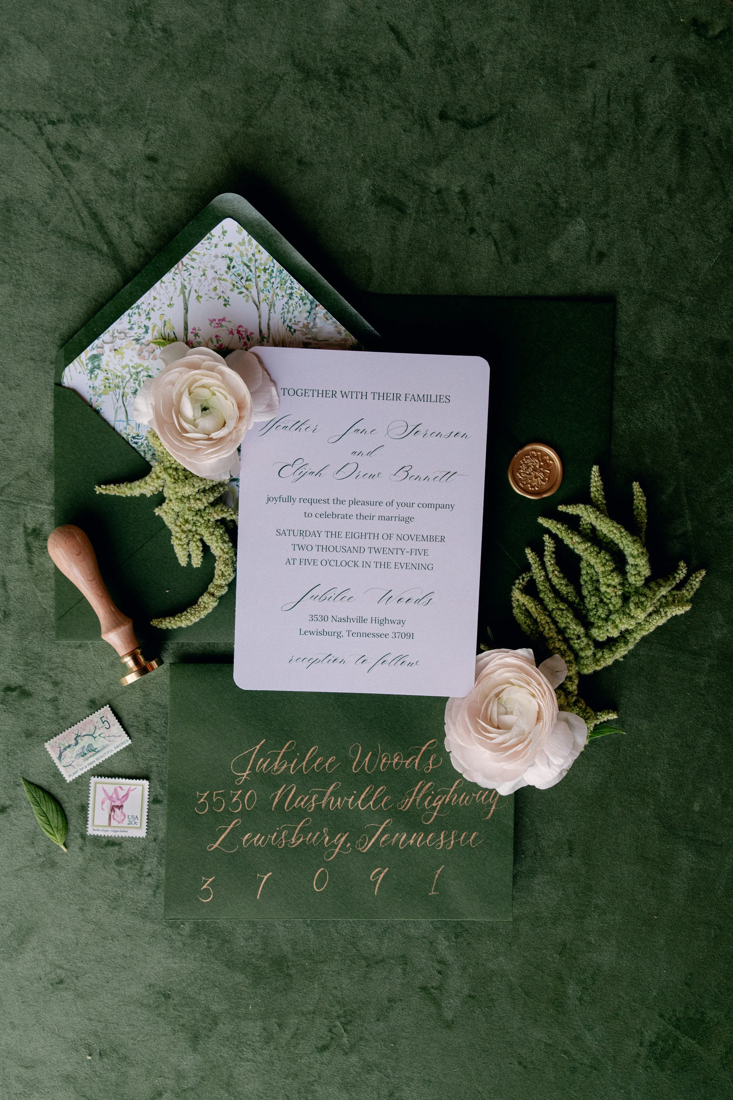Wedding invitation suite with floral decorations, wax seal, stamps, and address hand-lettered at Jubilee Woods in Lewisburg, Tennessee