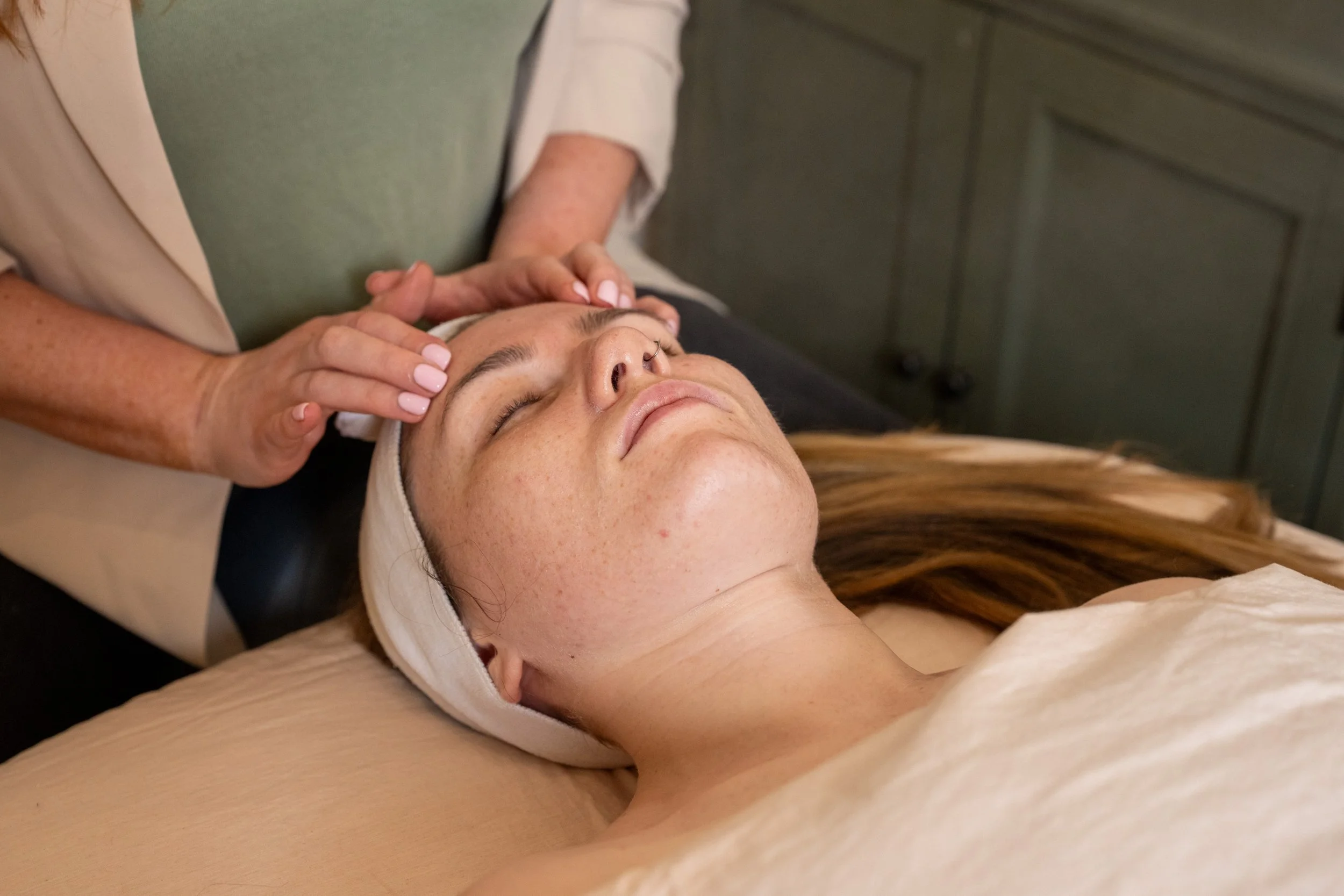 Woman receiving facial