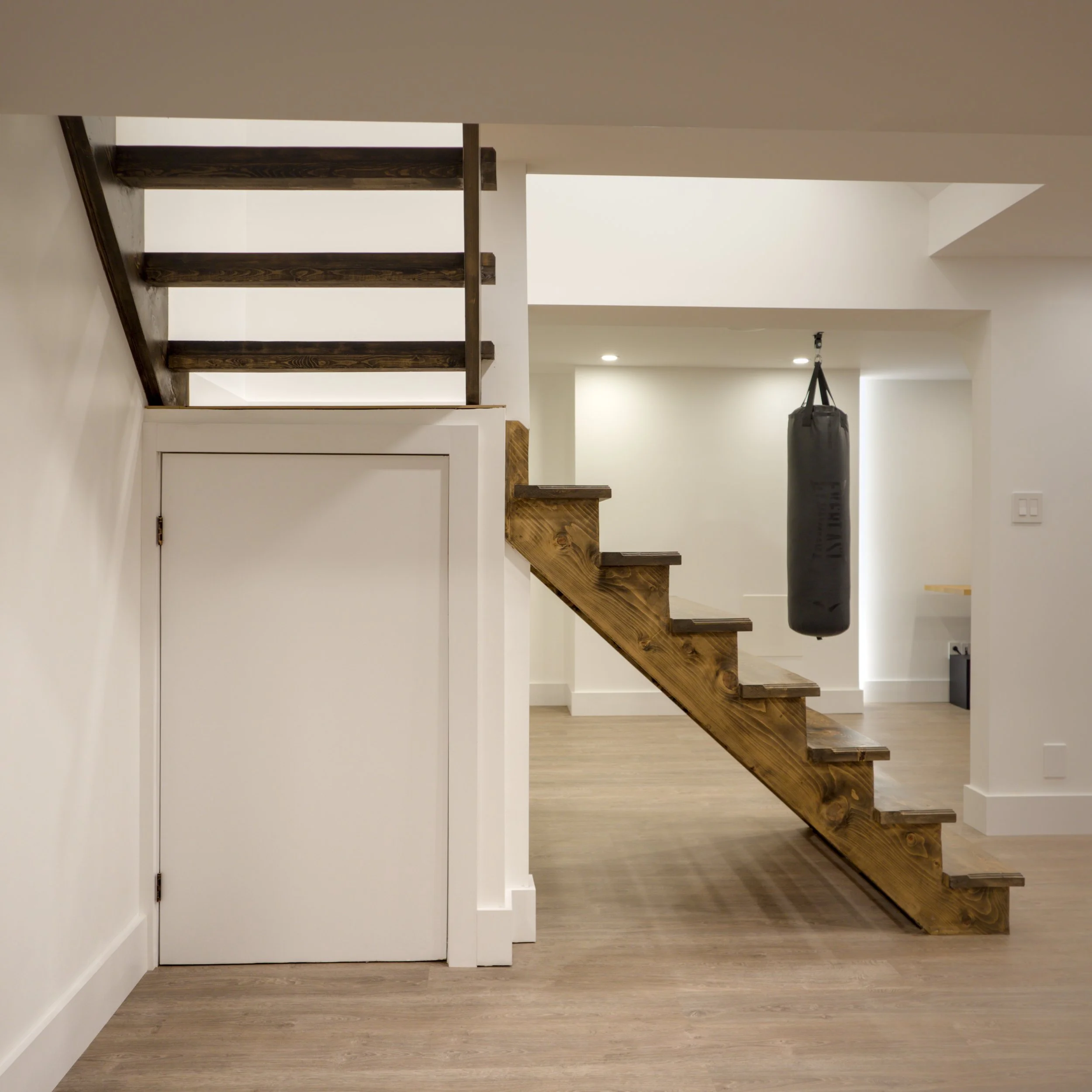 How We Turned a Builder-Grade Basement Staircase Into a Modern Showpiece