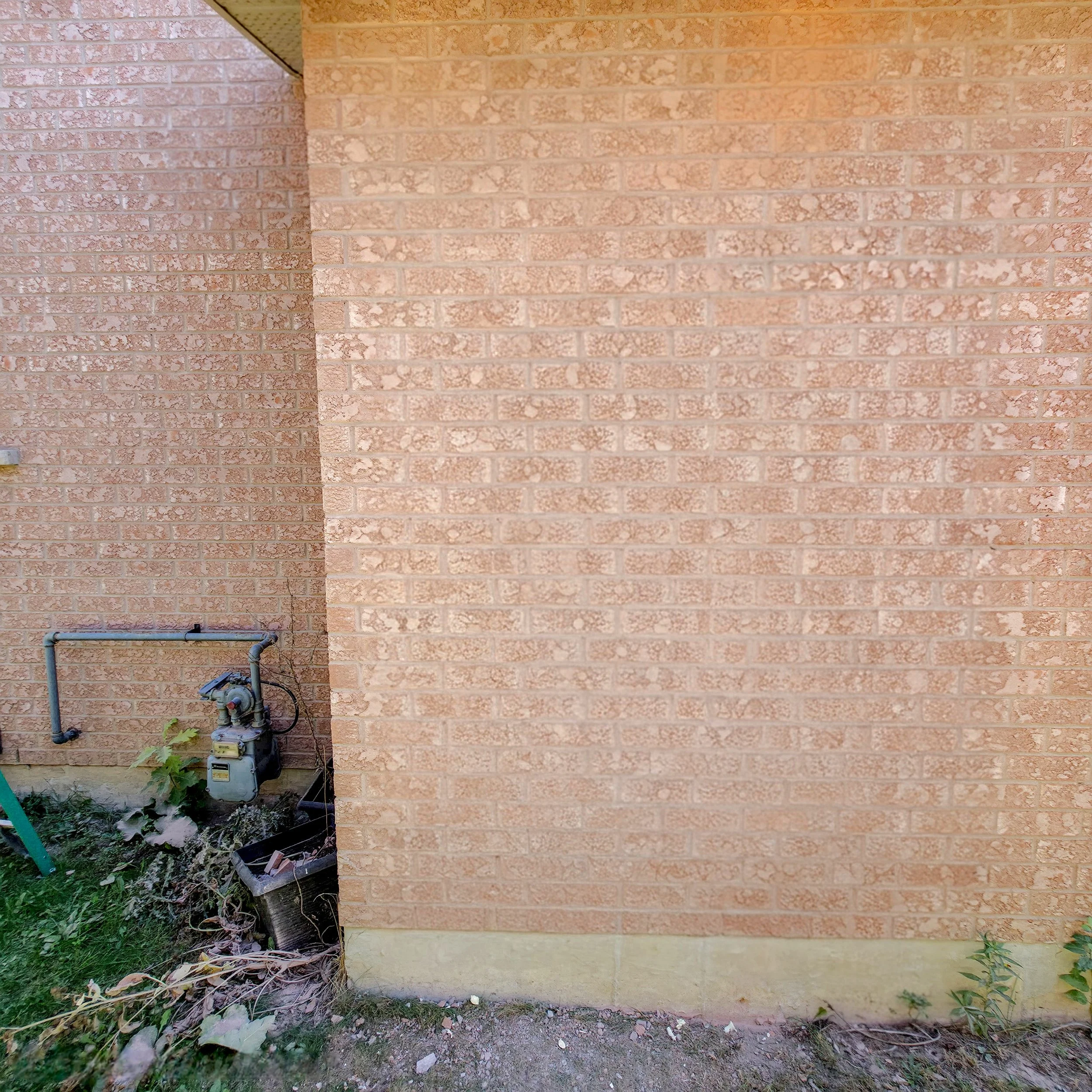 Brick garage wall before side entrance installation – Pam Arc Inc.