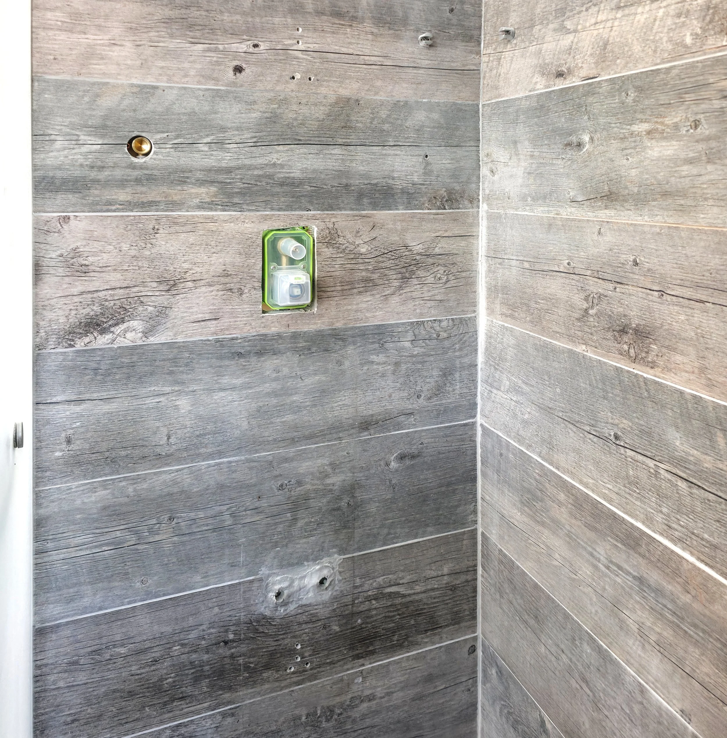 A bathroom renovation in Richmond Hill, Ontario showing the plumbing rough in has been installed by Pam Arc inc.