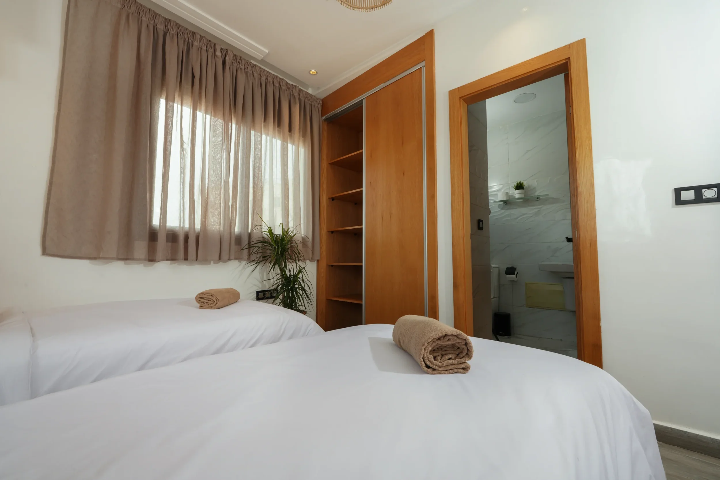 clean-bed-with-towle-and-nice-closet-in-residence-imsouane-surf-cam--scaled.webp