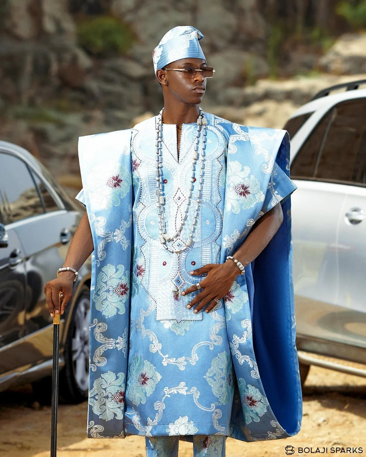Sky blue Agbada with soft floral and vine-like embroidery, photography by Shuaibu Bashir