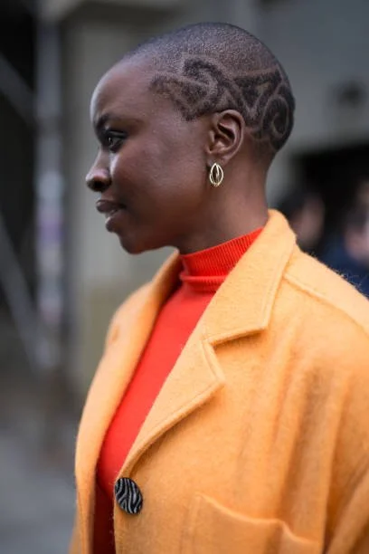  Danni Guirara attending EDUN in a low cut with intricately shaped designs, photography by Matthew Sperzel/Getty Images    