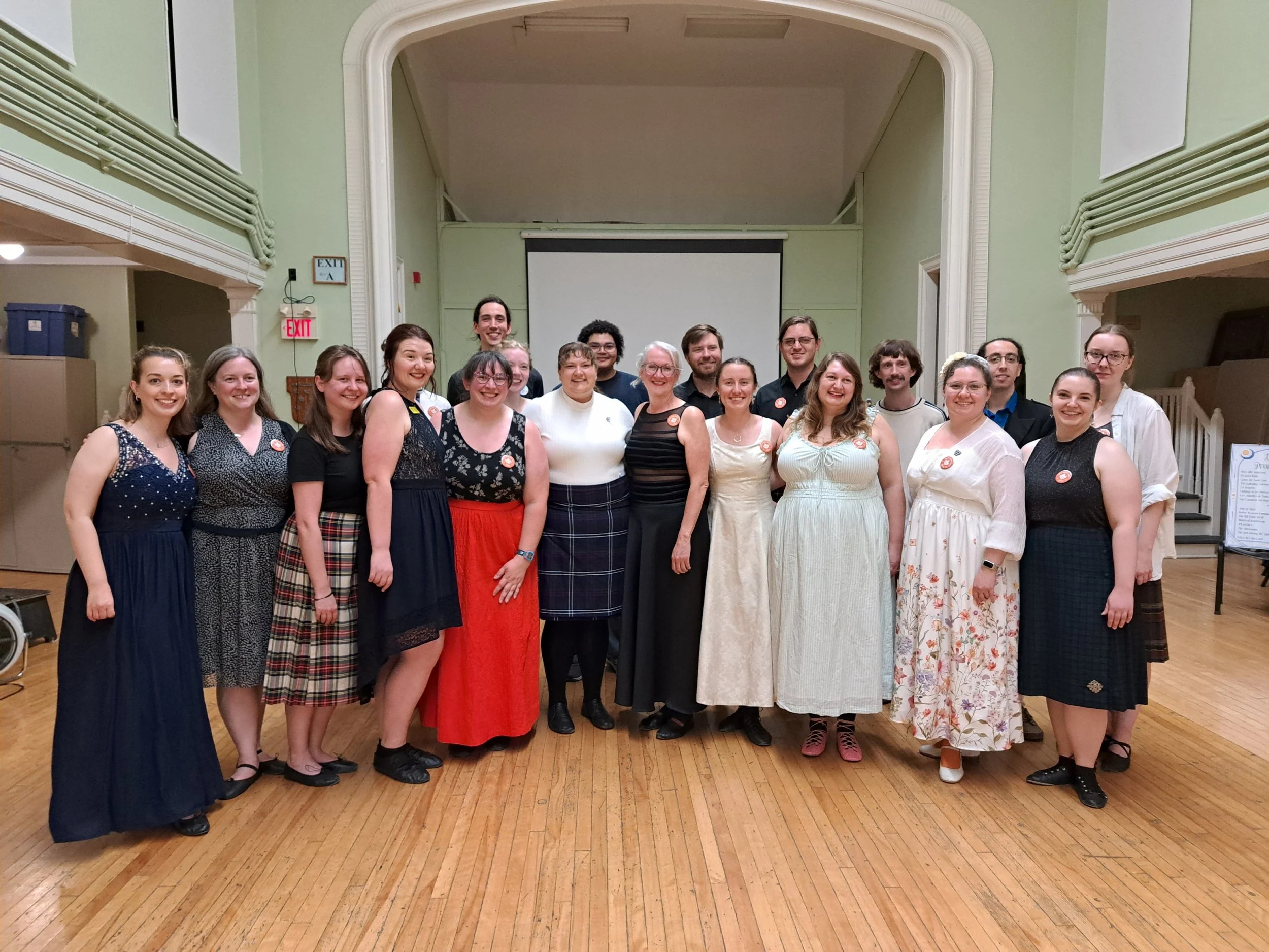 Young people in a group photo, dressed for a Scottish country dance