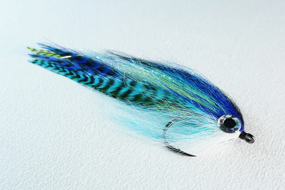 Megafin Mega Hollow Baitfish fly in the Mackerel color on a white background