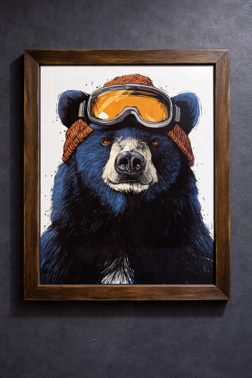 Art illustration of a bear wearing ski goggles and a brown beanie, framed on a black wall.