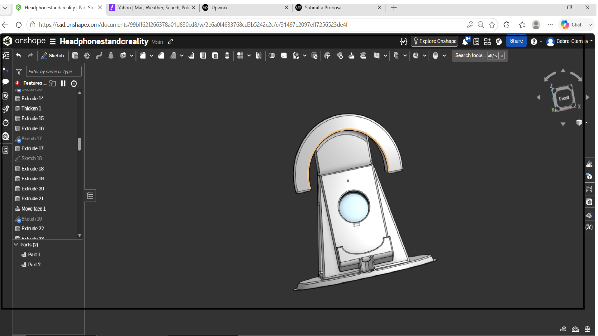 A 3D CAD model of a device with a rounded top, a circular screen or button on the front, and a base, designed in Onshape CAD software.