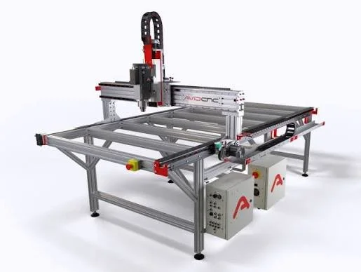 A large laser cutter with a black frame and a white cutting surface, featuring control panels and ventilation on the side.