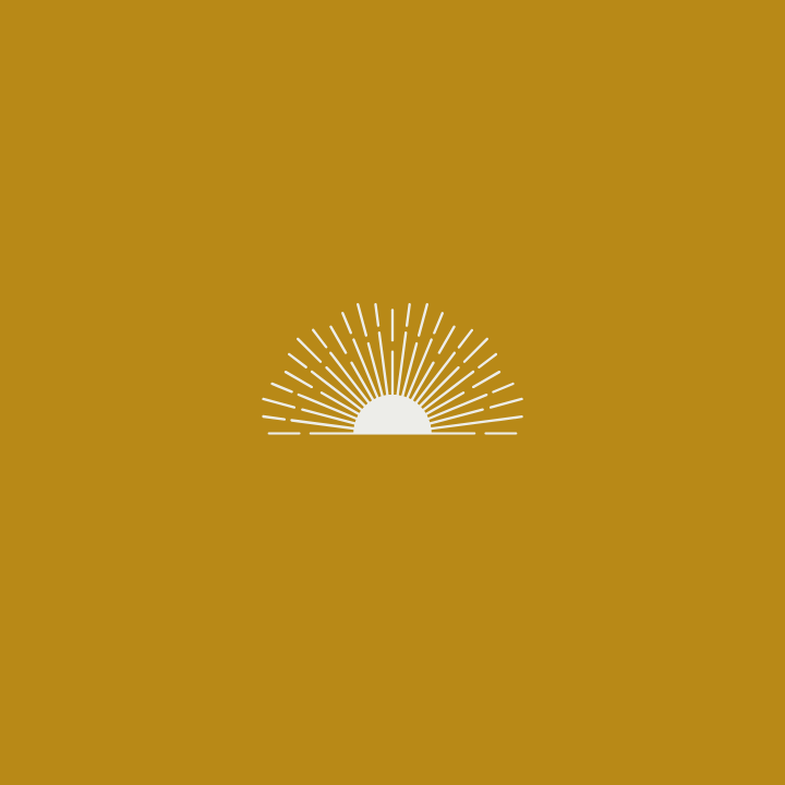 Sunrise or sunset with rays shining upward, set against a gold background.