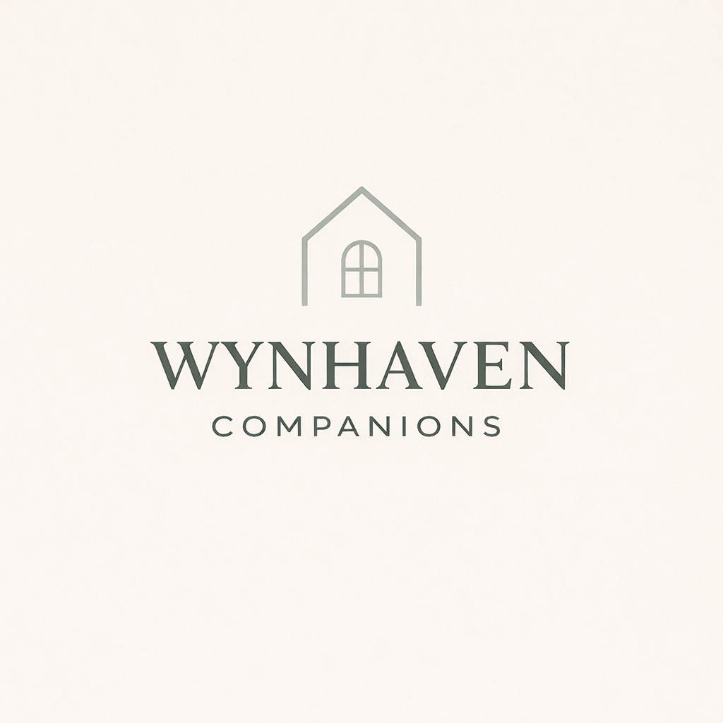 Logo for WynnHaven Companions featuring a simple house outline and the text 'WynHaven Companions' beneath it.