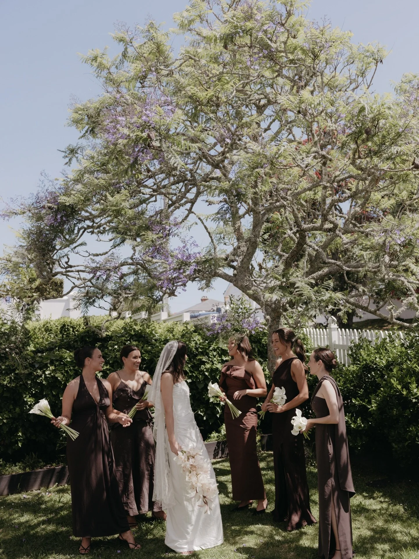 Thea &amp; Jason one sunny November day.
Slide four is one of my favourites. The little girls next door heard whispers of a wedding. Waiting in suspense to get a glimpse of the bride, with freshly picked hydrangeas at the ready. A moment they will mo