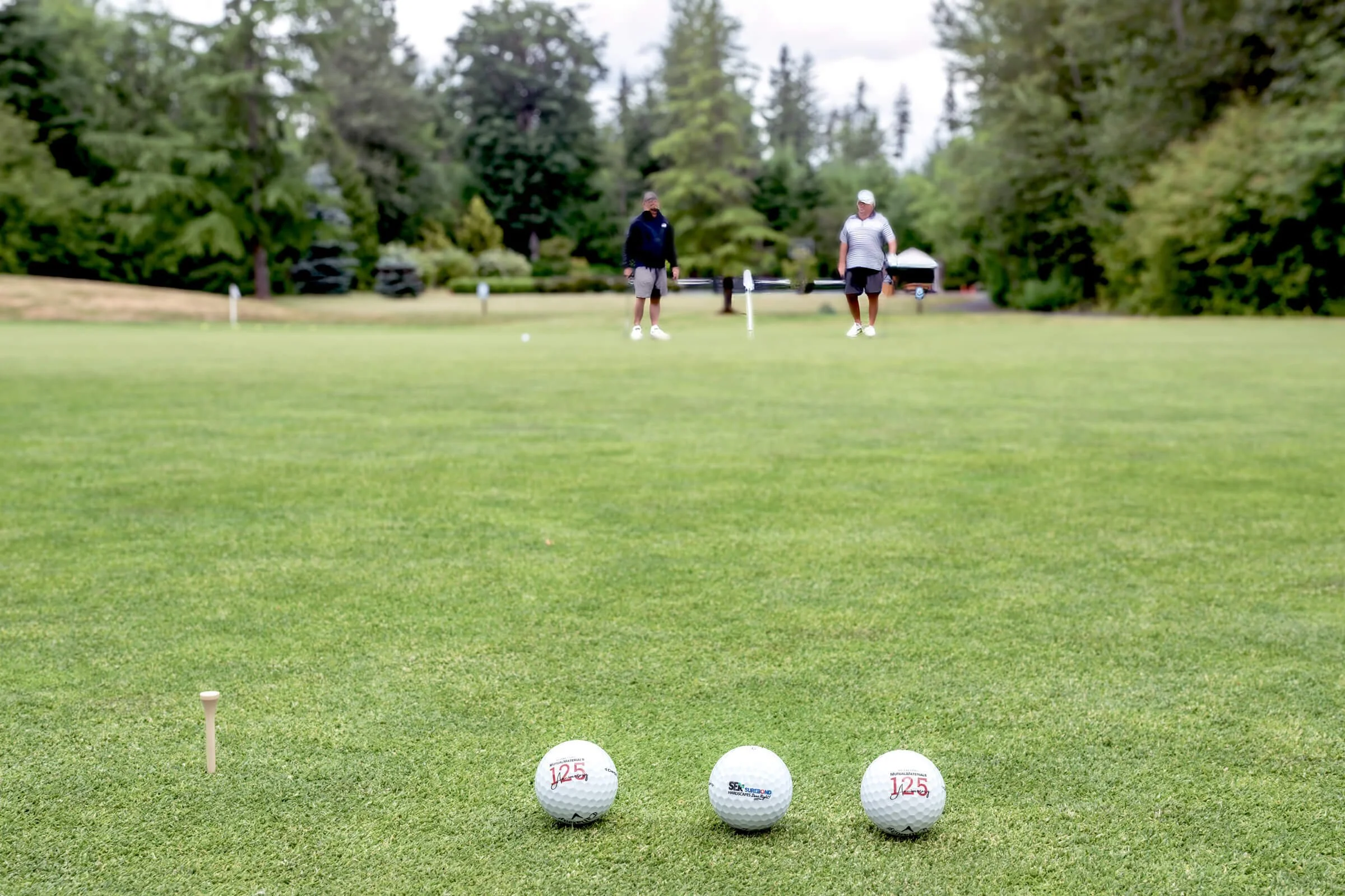 Branded event golf balls designed for on-course visibility.