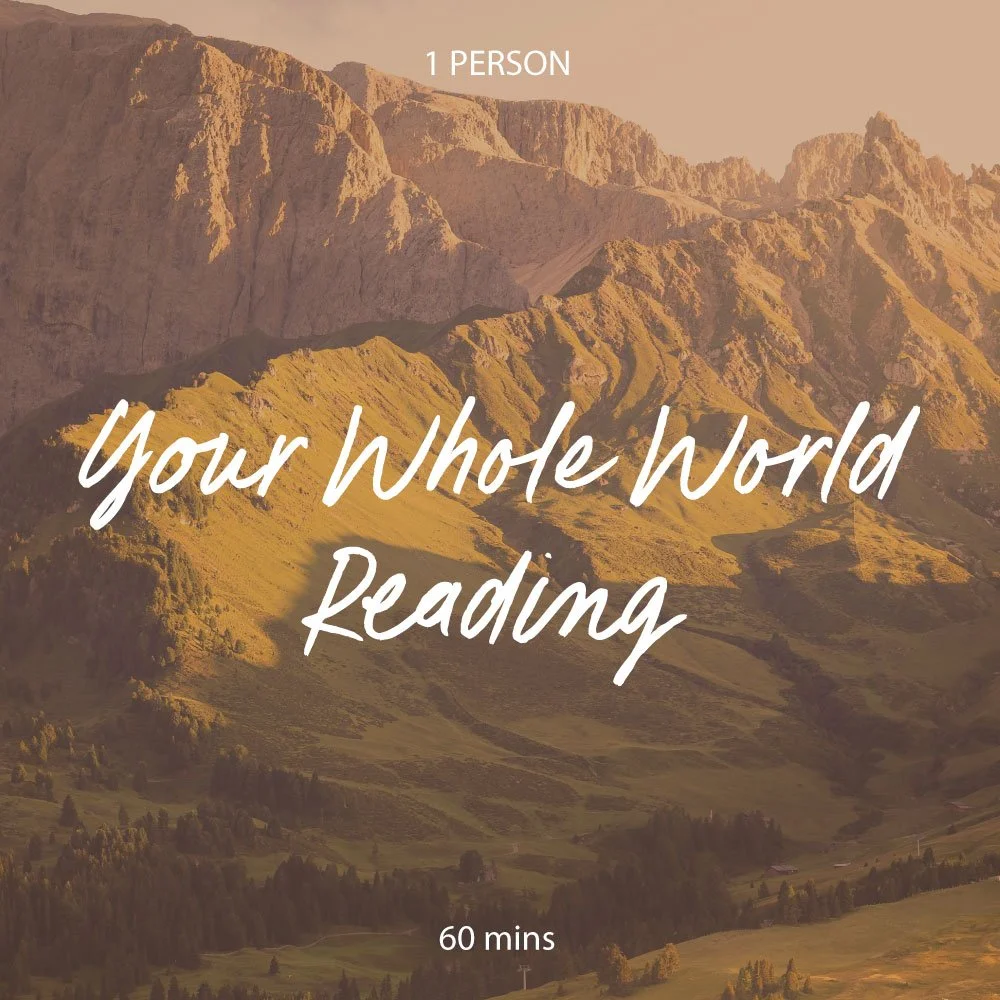 A scenic landscape of mountains with green slopes during sunset or sunrise.