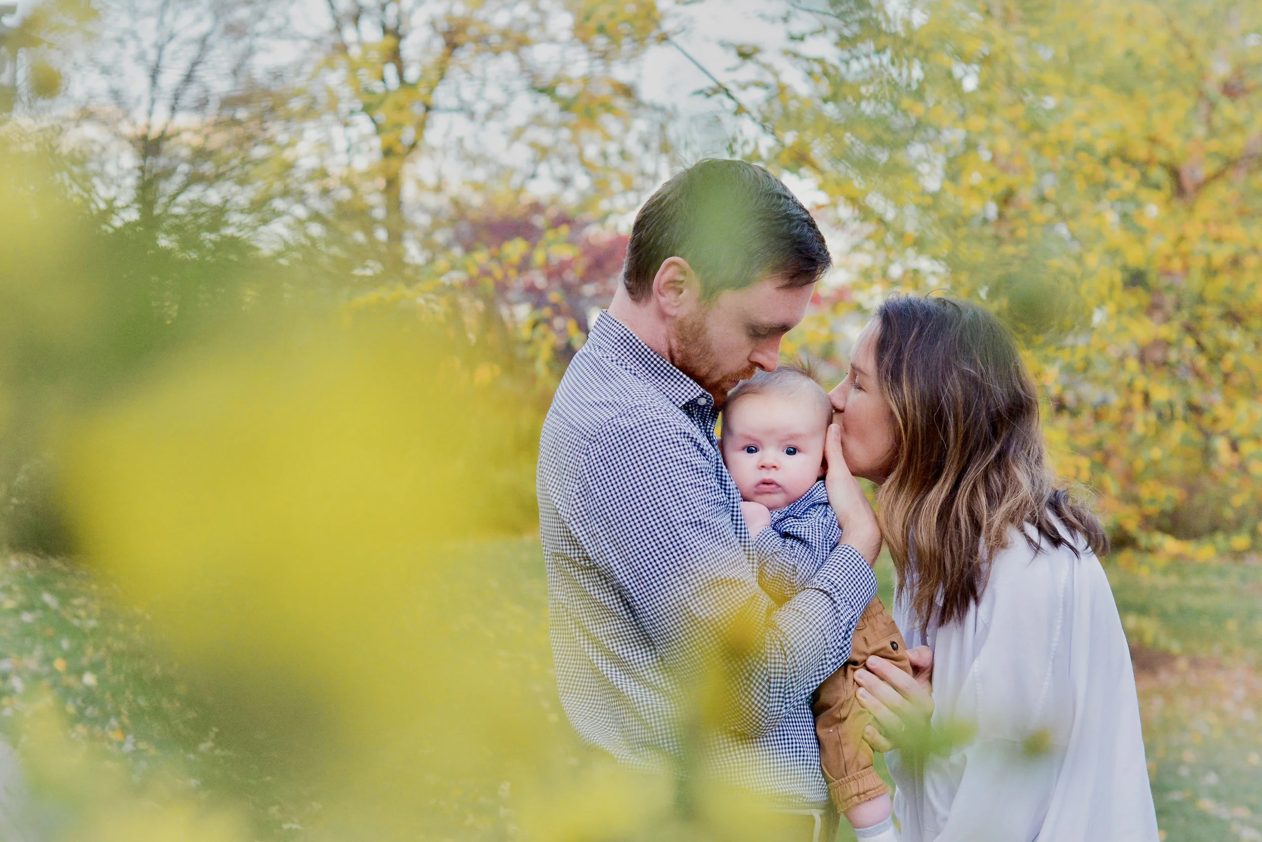 AndreaBrubakerMPLSPhotographer_Family framed by foliage.jpg
