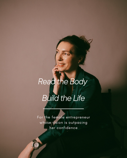 Dr. Kat seated in a minimalist studio, smiling and looking to the side, representing calm confidence and nervous system precision for high-performing professionals.