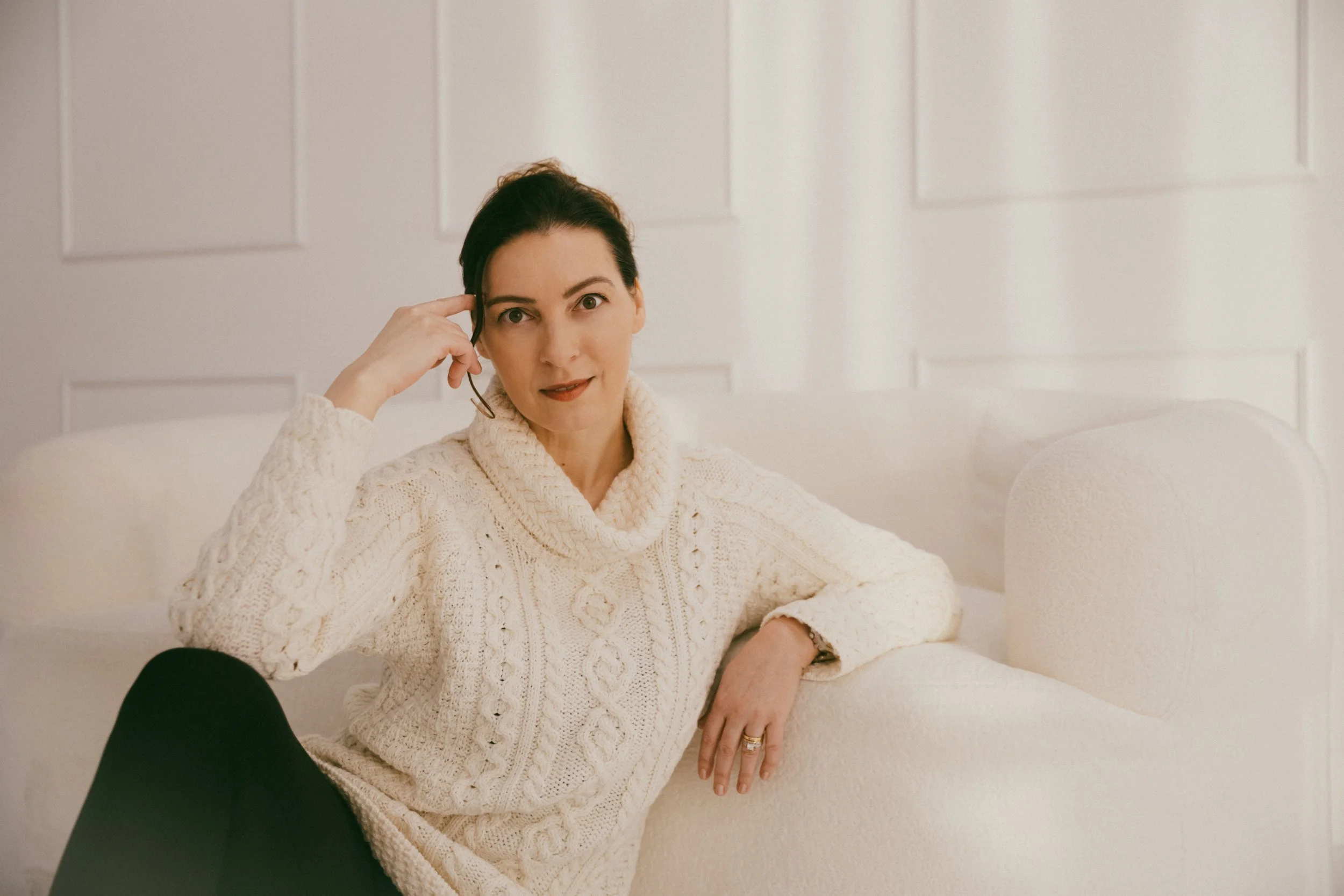 Dr. Kat in calm studio portrait representing nervous system stabilization, biological leadership, and grounded authority.