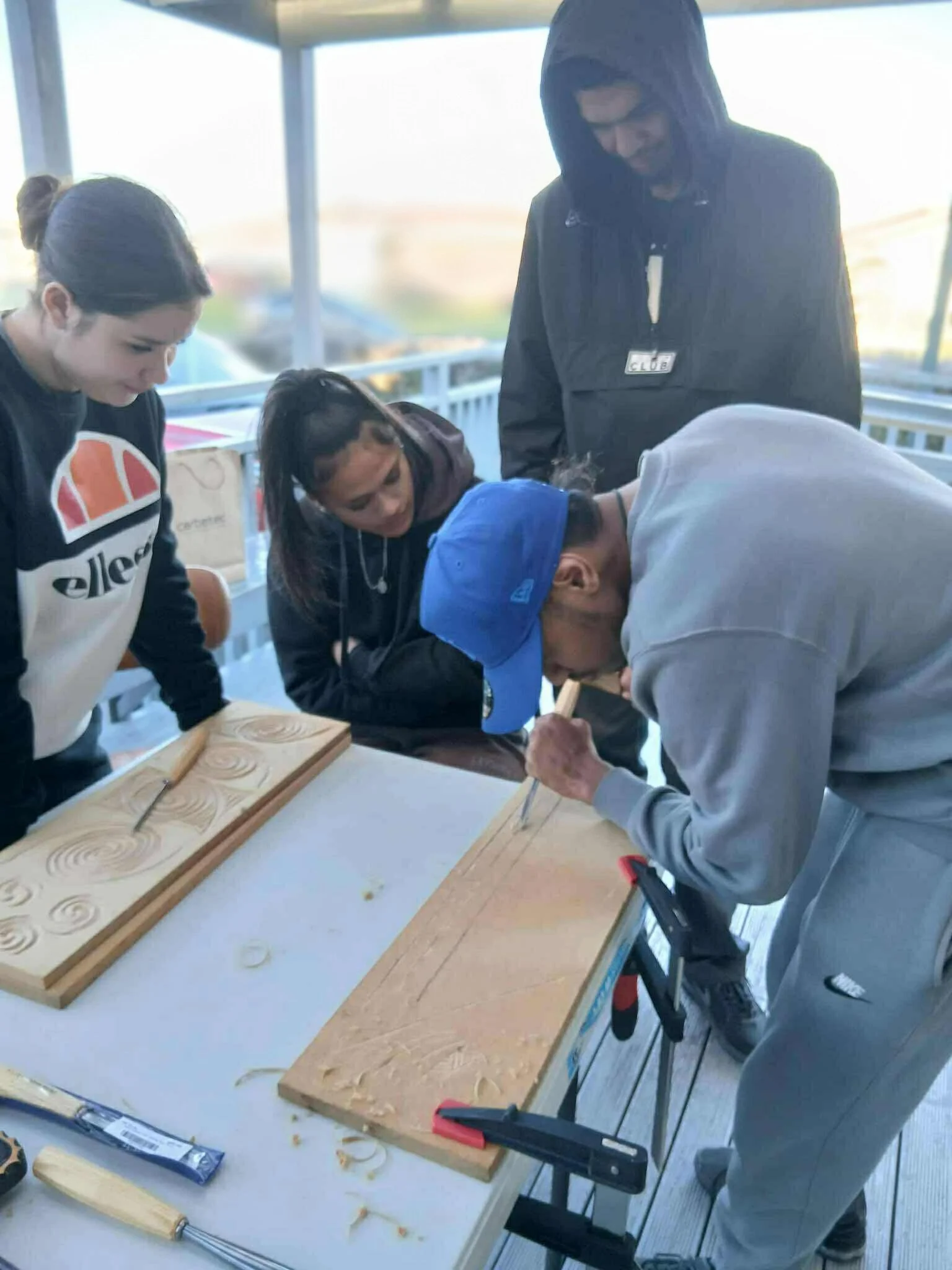 Rangatahi getting to grips with the chisels at Ali's carving group recently - they will be making a taonga to give to a loved one