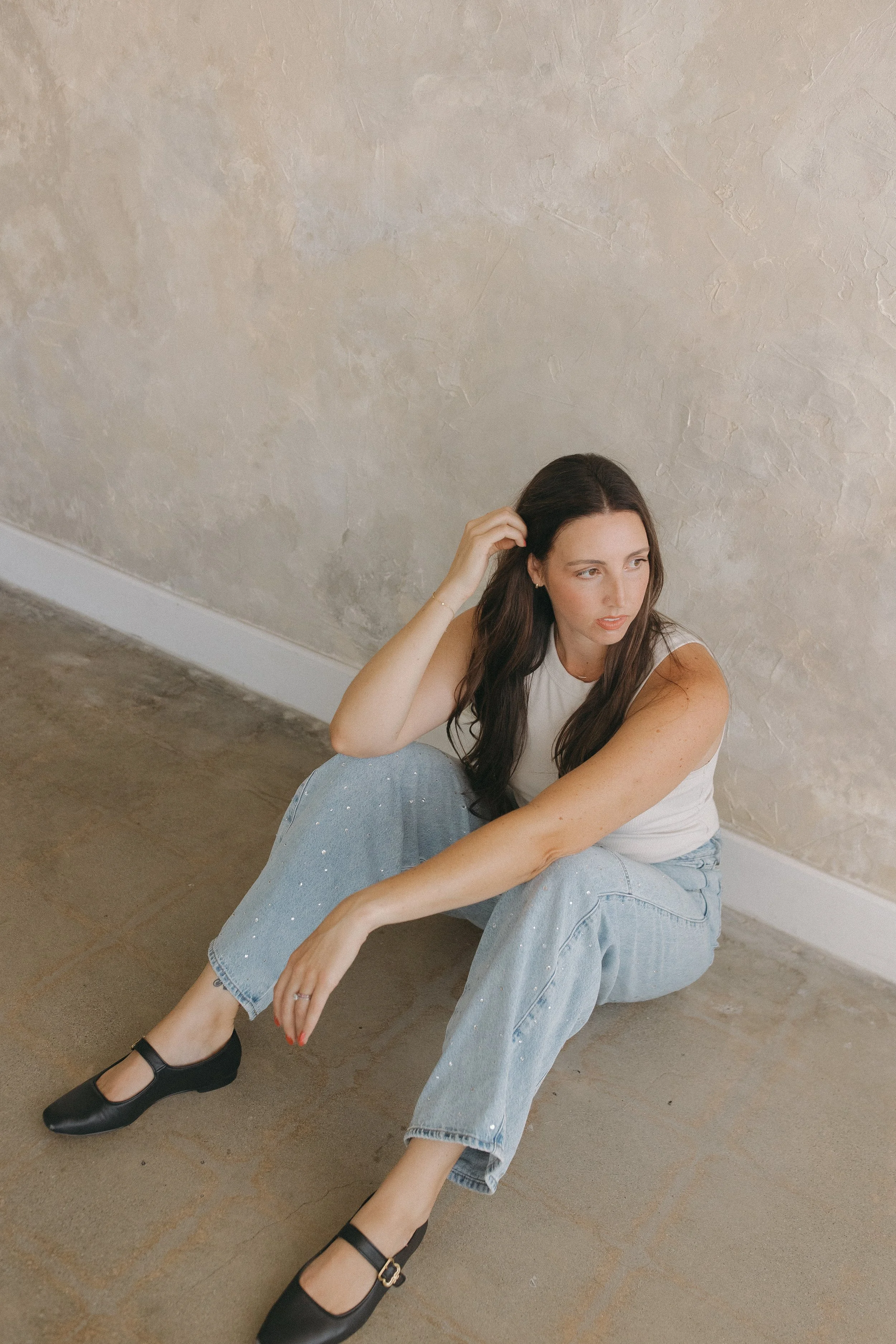 San Diego photographer posing on ground looking away