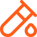 Orange medical syringe with a drop of liquid at the tip.