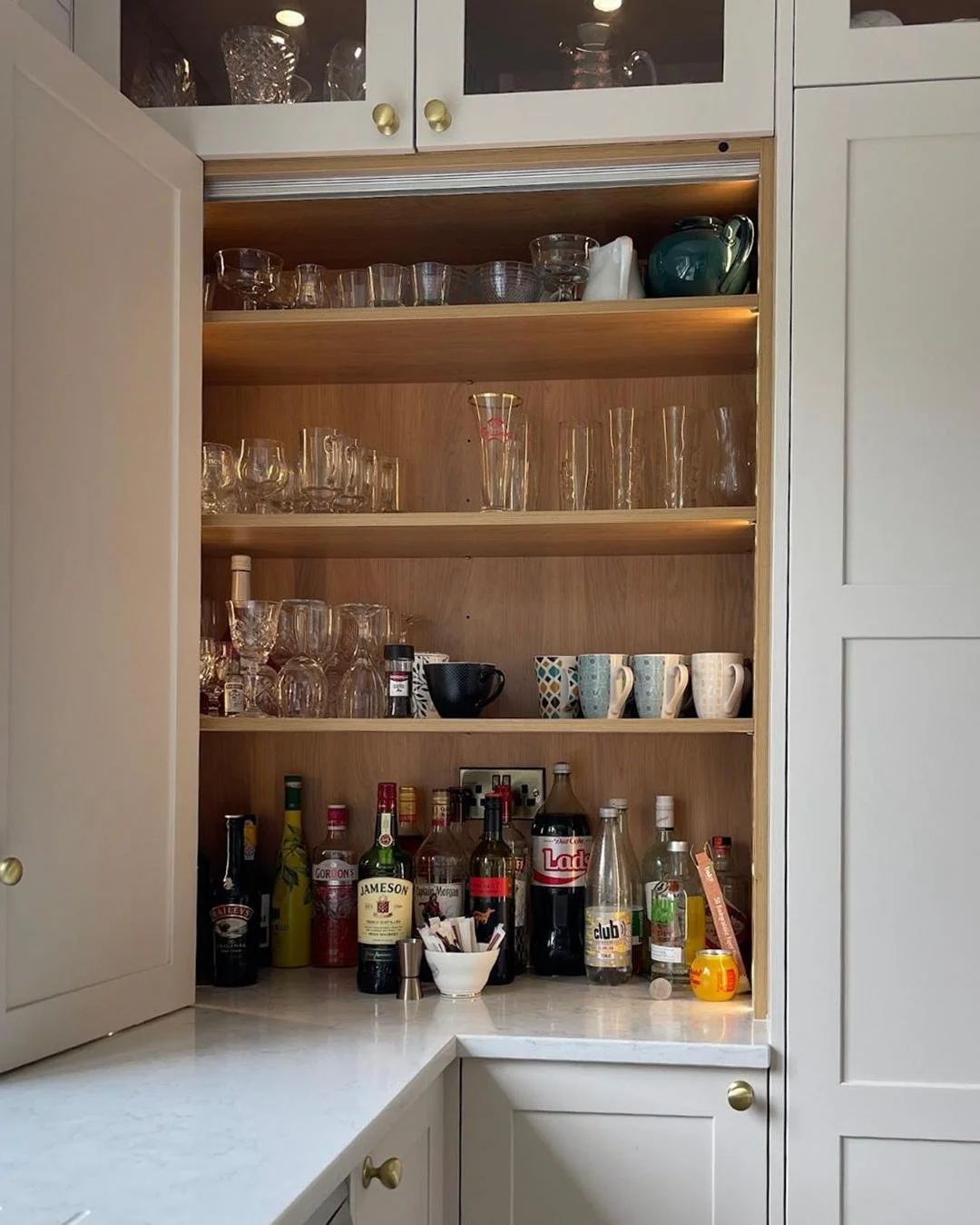 Mornings start smoother when everything&rsquo;s right where it belongs. The bi-fold cabinets in this kitchen keep bowls and breakfast essentials close at hand, making early routines feel effortless. The pantry neatly stores snacks, spices, and those 