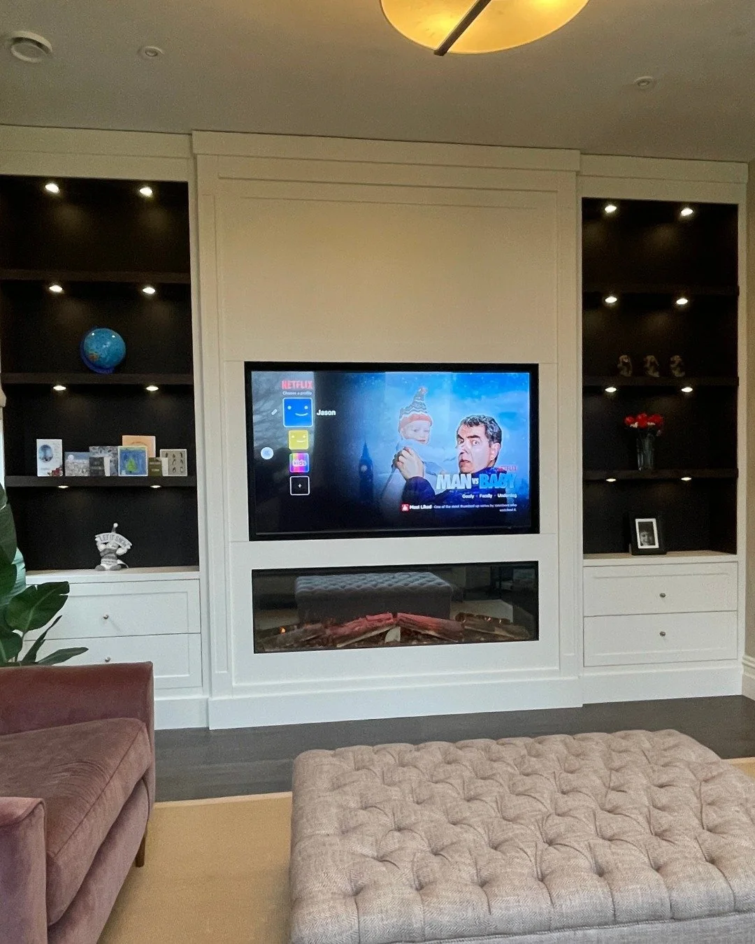 Everyday life unfolds effortlessly around this media wall, designed to blend everyday use with comfort. Finished in Little Greene&rsquo;s &lsquo;Slaked Lime&rsquo;, it keeps the room feeling organised and inviting throughout daily use. The shaker-sty