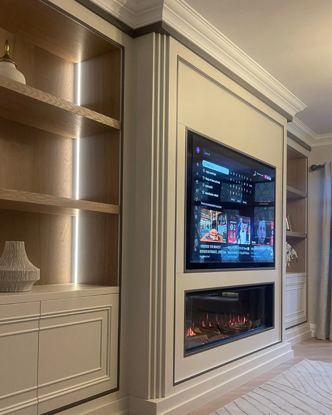 Each of these media walls is shaped around how the living room is used in the evenings. The first features Farrow &amp; Ball&rsquo;s &lsquo;Skimming Stone&rsquo; with &lsquo;London Clay&rsquo; inlays, where double-moulded push-to-open doors are paire