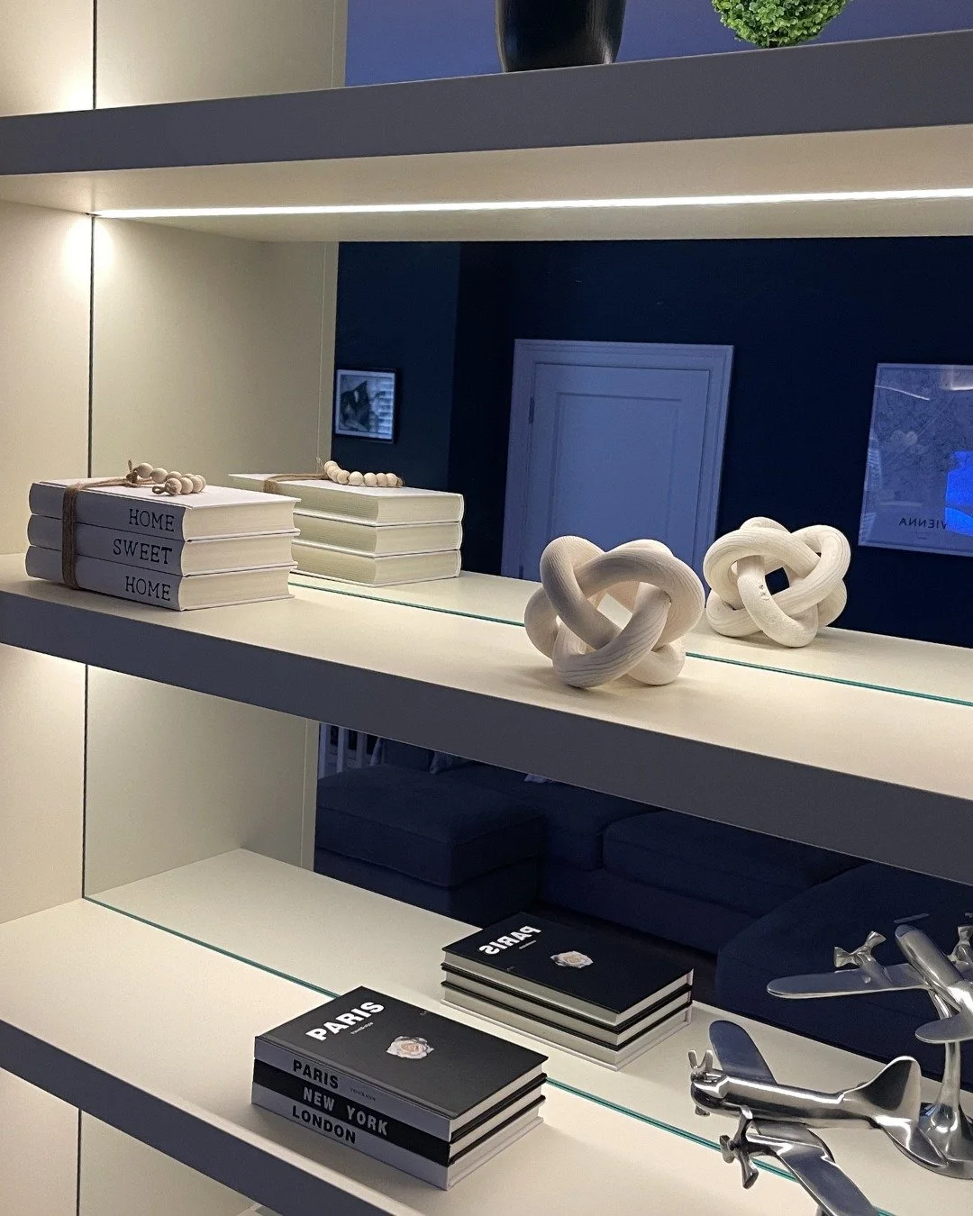 Finished in &lsquo;French White&rsquo;, the cabinetry adds a soft, elegant touch, with moulded shaker-style doors that define the media wall&rsquo;s shape and character. It perfectly suits the typical end-of-day routines: a film playing, background m