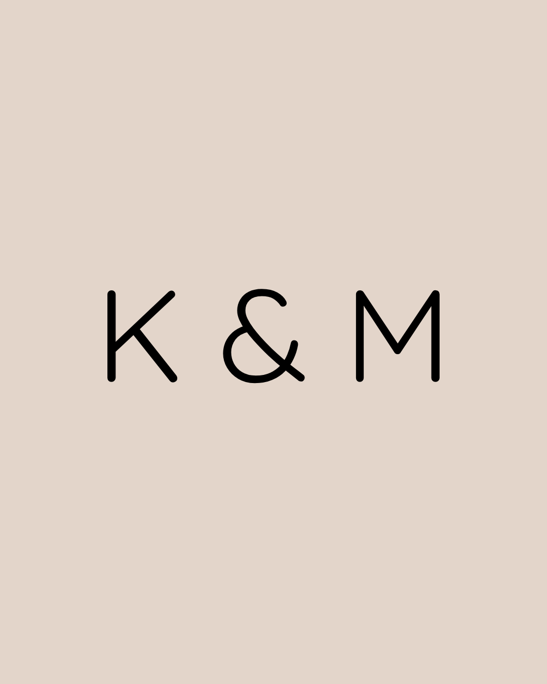 Black text 'K & M' centered on a beige background.