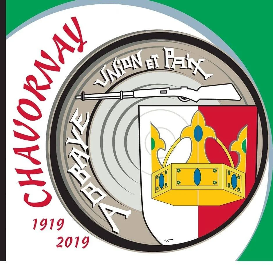 Emblem with a yellow crown, a white shield, and a rifle above, with red and white text reading 'CHAUROUAY' and '1919 2019' surrounding the emblem.