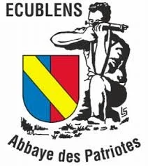 Logo of Eboulens featuring a person playing a flute and a shield with diagonal yellow and red stripes