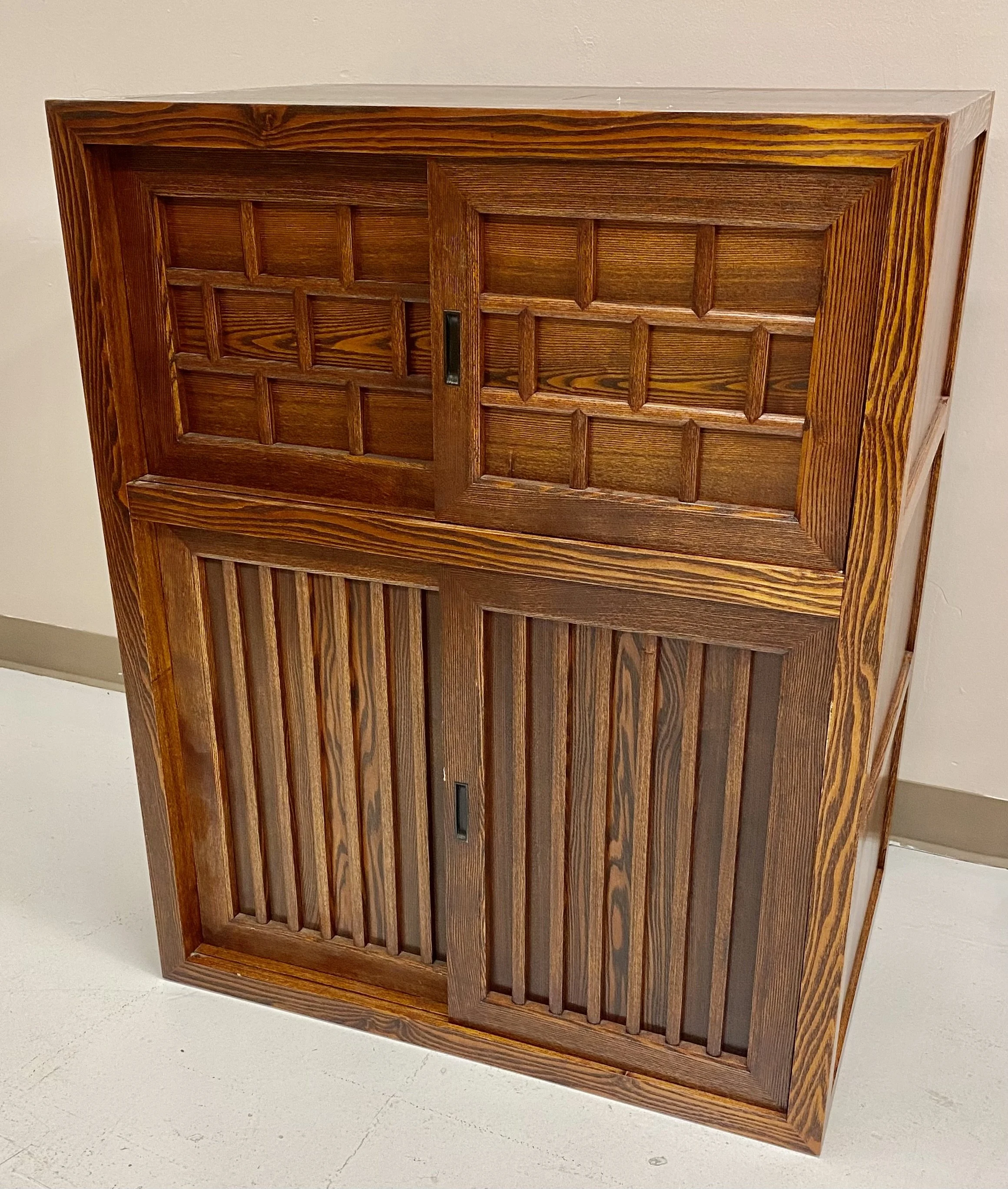 Japanese Carved Wood Side Cabinet with Sliding Doors
Size: 31 ½ inches wide x 22 inches deep x 39 ½ inches high
