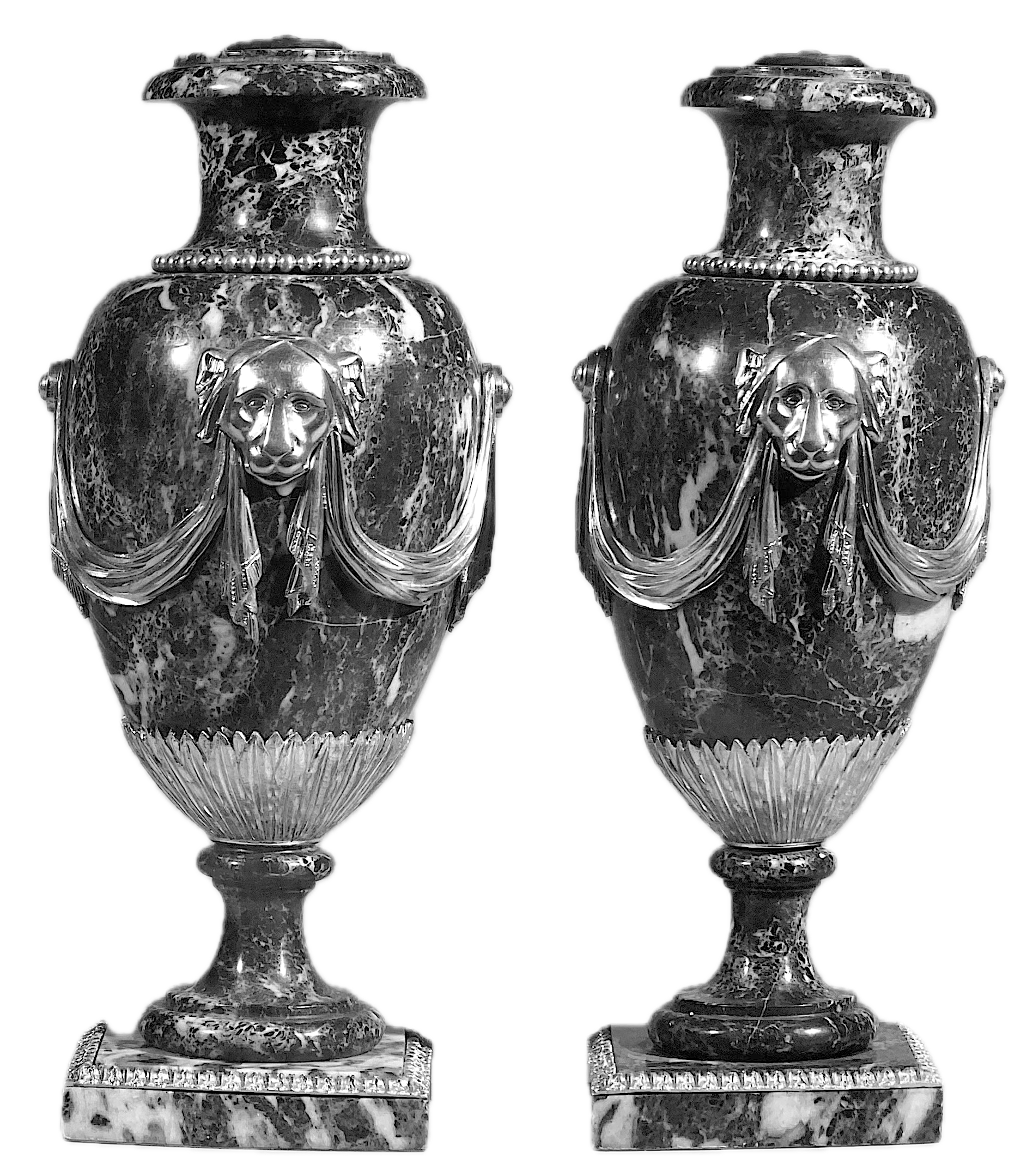 Pair of Louis XVI Marble and Lion and Swag Motif Ormolu Urns on Rectangular Plinths, Late 18th Century, now mounted as lamps (7 inches square x 15 ¾ inches high = urns) Provenance: Partridge Fine Arts, Ltd., London, GBP 8,500 ($ 15,300 USD)