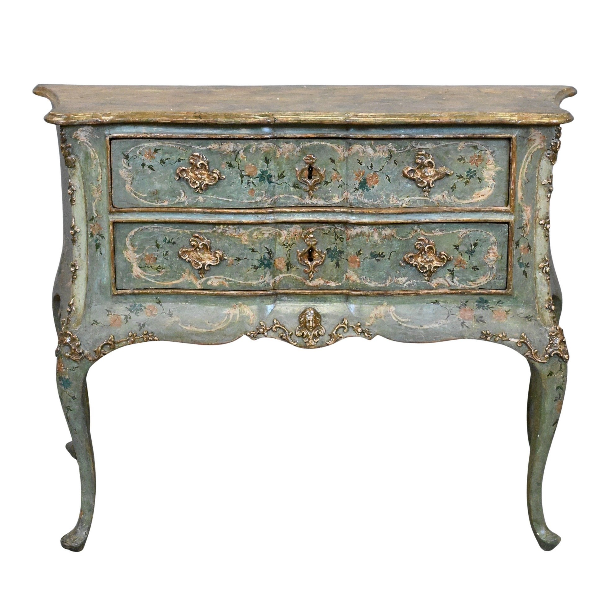 Italian Rococo Polychrome-Painted Commode with Faux Marble Top
having serpentine rectangular top painted to simulate variegated marble above two long drawers decorated with floral sprays and scrollwork on a pale green ground, framed by molded borders