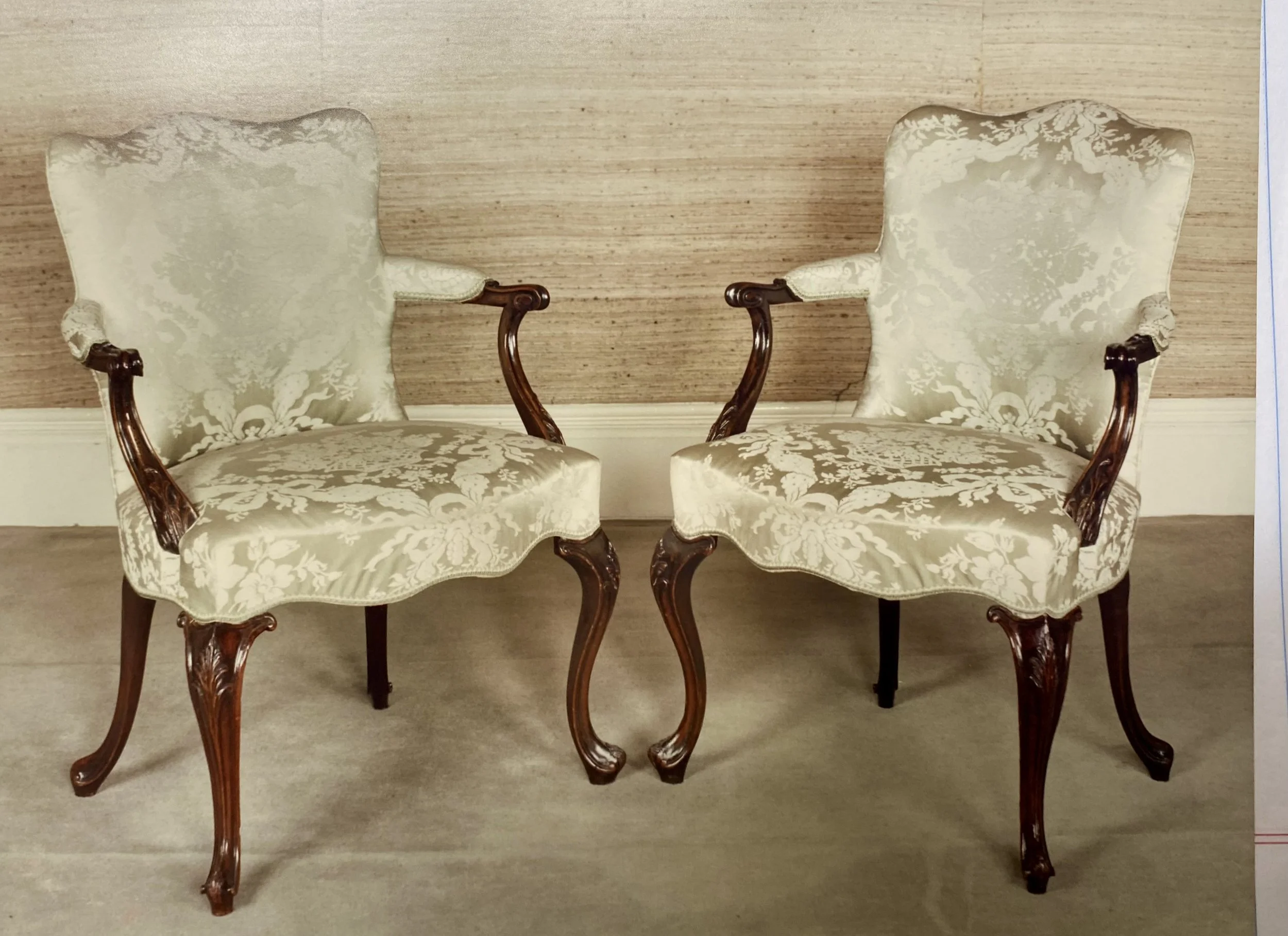 Pair of George III Mahogany Armchairs of Serpentine Outline, in the French Taste, England, Second Half of the 18th Century (now with distressed upholstery). Provenance: Philip Hewat-Jaboor, 1987