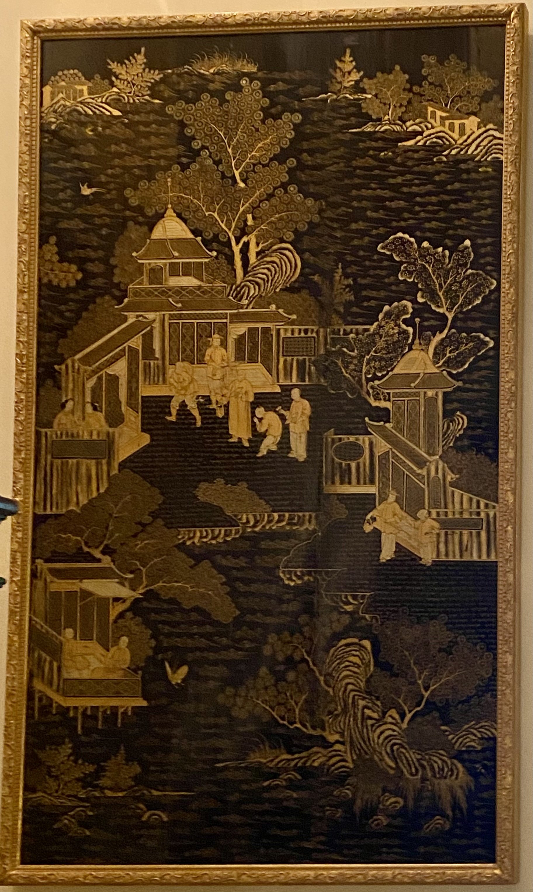 Pair of Large Chinese Black Lacquer and Gilt Export Panels, 19th Century;
Finely decorated with idyllic palace scenes populated by throngs of people
Illustrating a range of society from humble peasants to lofty noblemen,
Set in a background of lush f